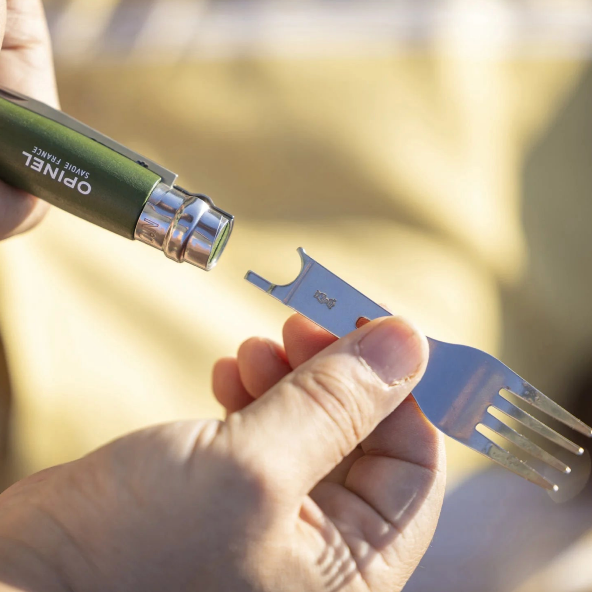 Man using Opinel Picnic Complete Set w/No8 Knife SS attaching fork component to the base