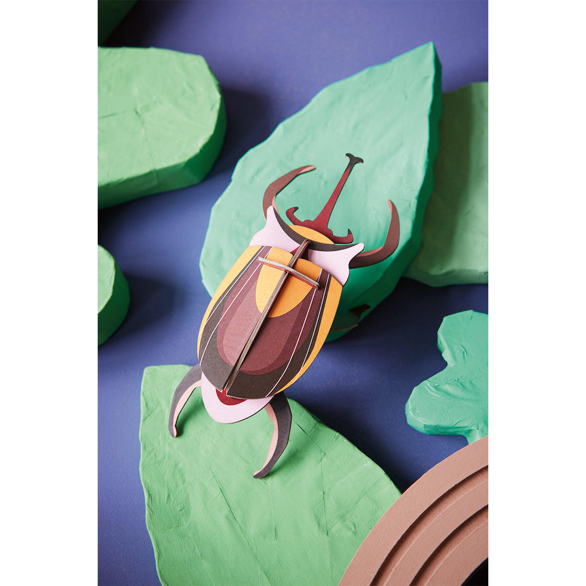 Studio Roof B7 elephant beetle wall art climbing on green leaves on purple background 