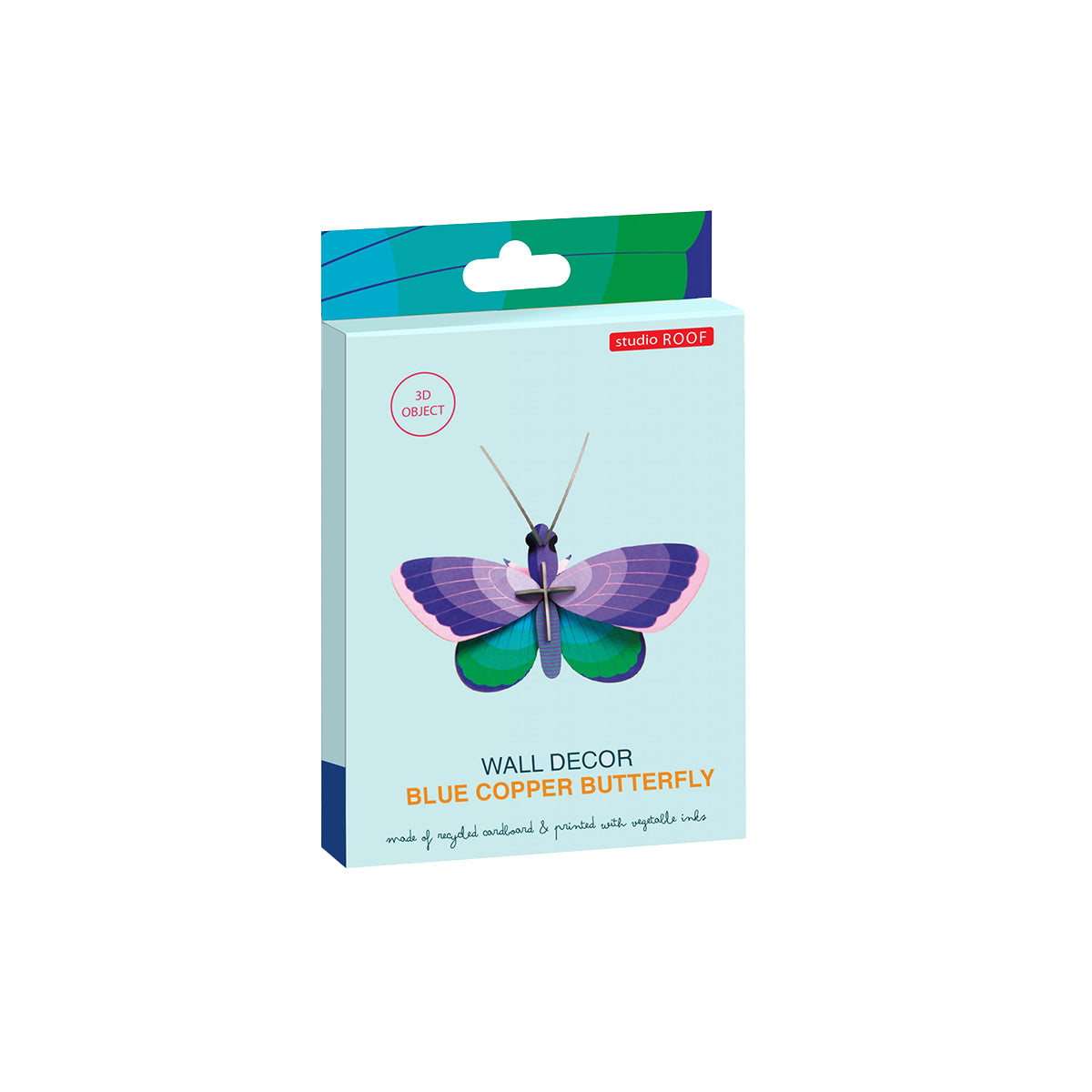 Flat card packaging of Studio Roof B7 blue copper butterfly wall art on a white background