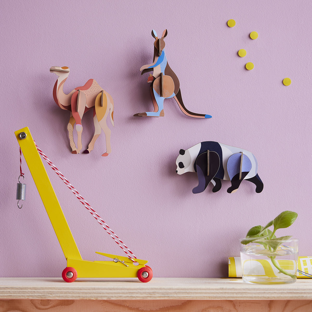 Studio Roof B7 kangaroo camel and panda animals wall art on lilac wall above yellow crane
