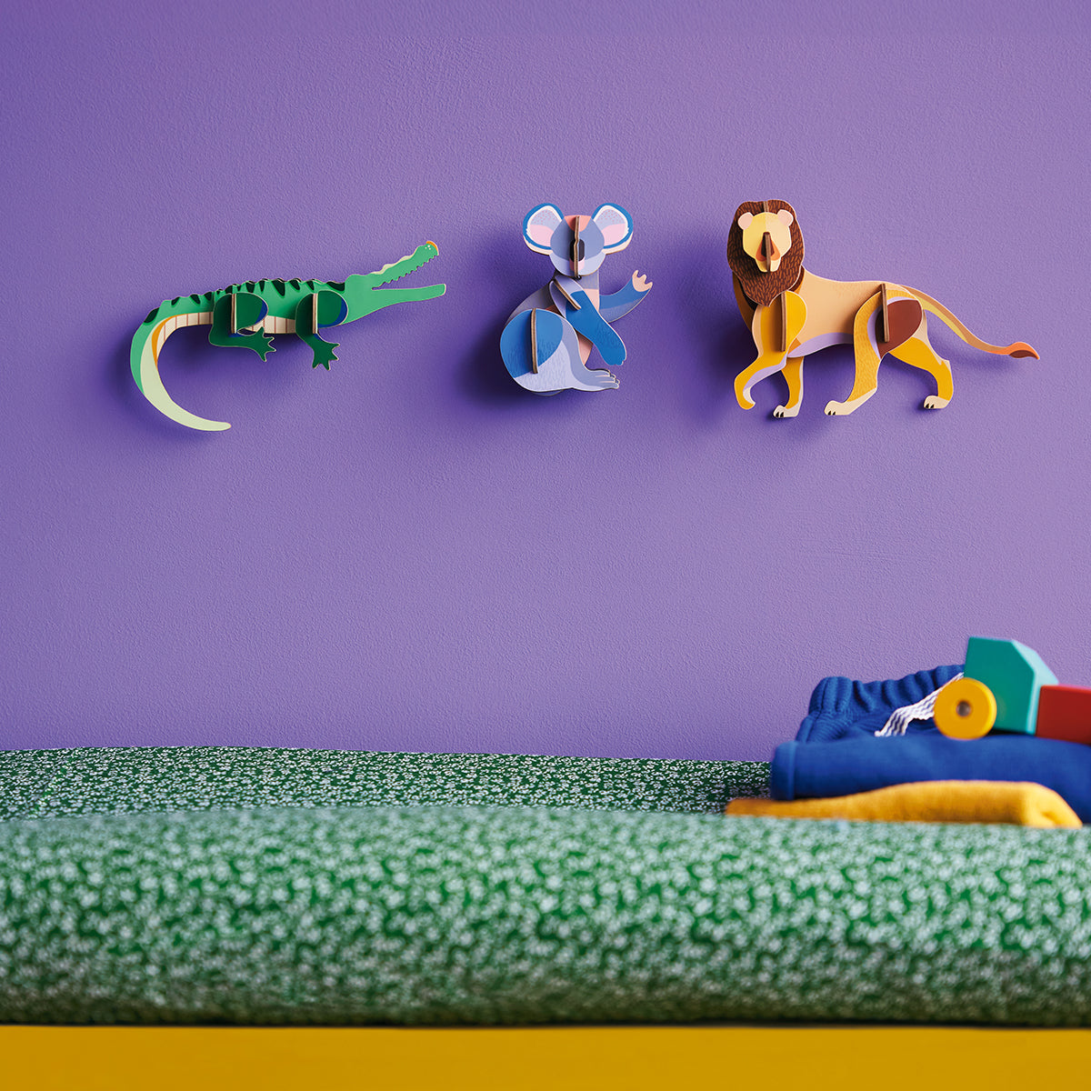 Studio Roof B7 koala camel and panda animals wall art on lilac wall above yellow crane