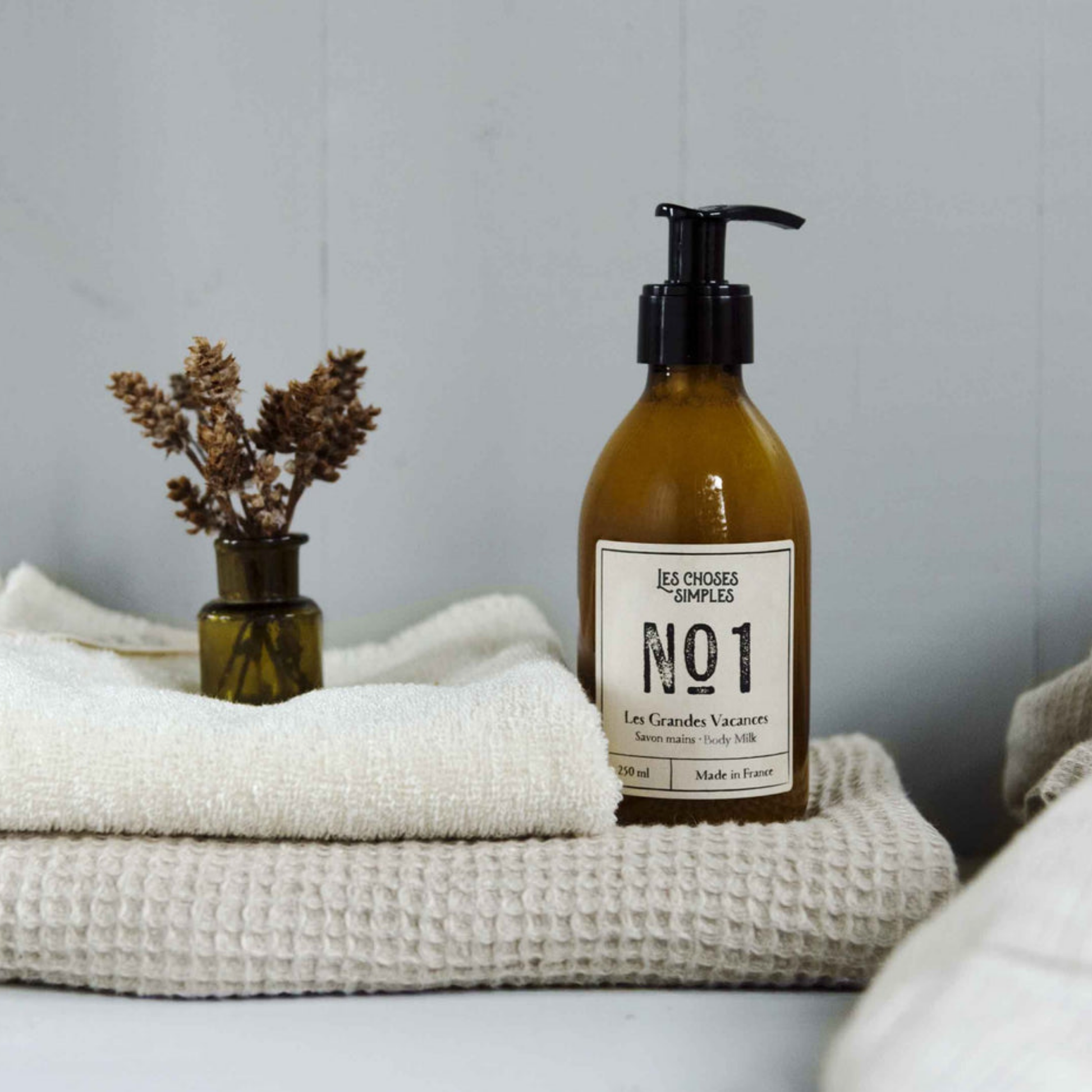 Les Choses Simple Shea Butter Body Milk 250ml Les Grande Vacances on display in bathroom with linen and towels