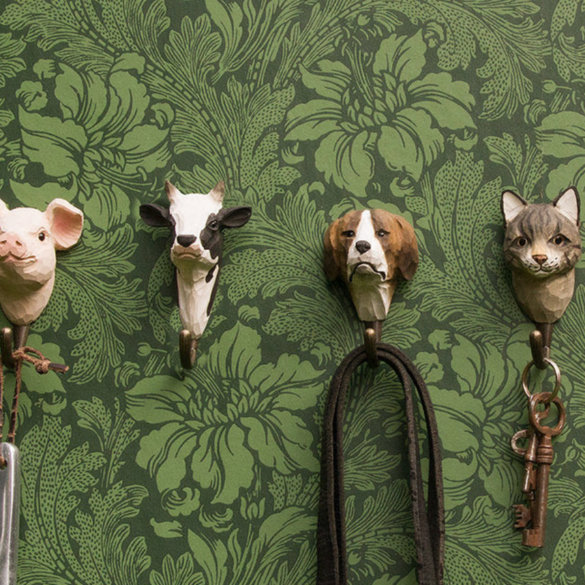 Wildlife Garden Wall Hook Cow on display hung on wall with other animal hooks from Wildlife Garden Wall Hook range 