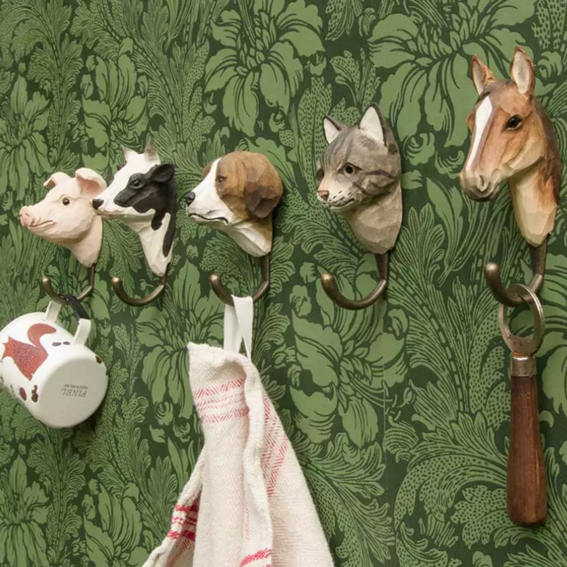 Wildlife Garden Wall Hook Dog on display hung on wall with other animal hooks from Wildlife Garden Wall Hook range 