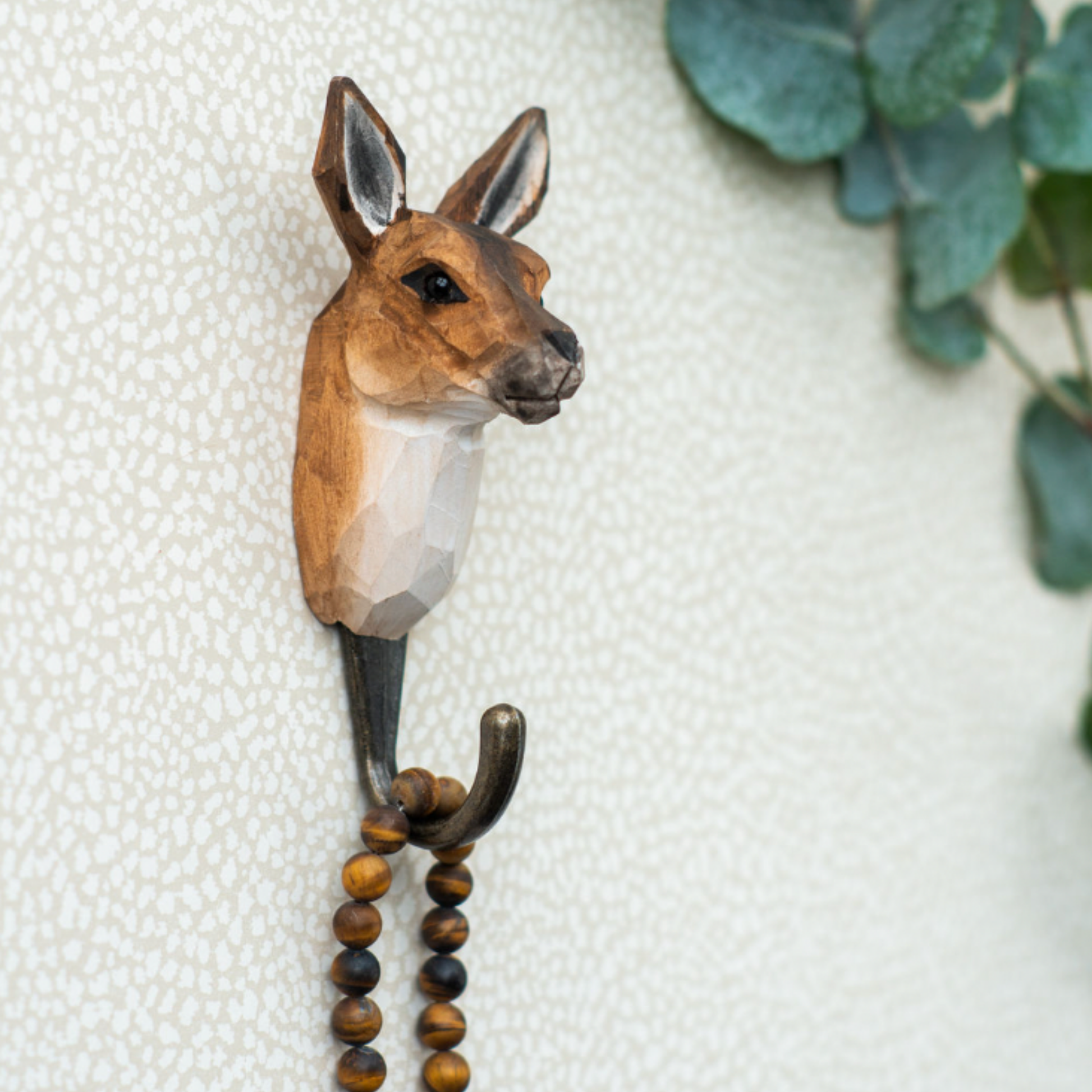Close up of Wildlife Garden Wall Hook Kangaroo hanging on wall holding beads on hook