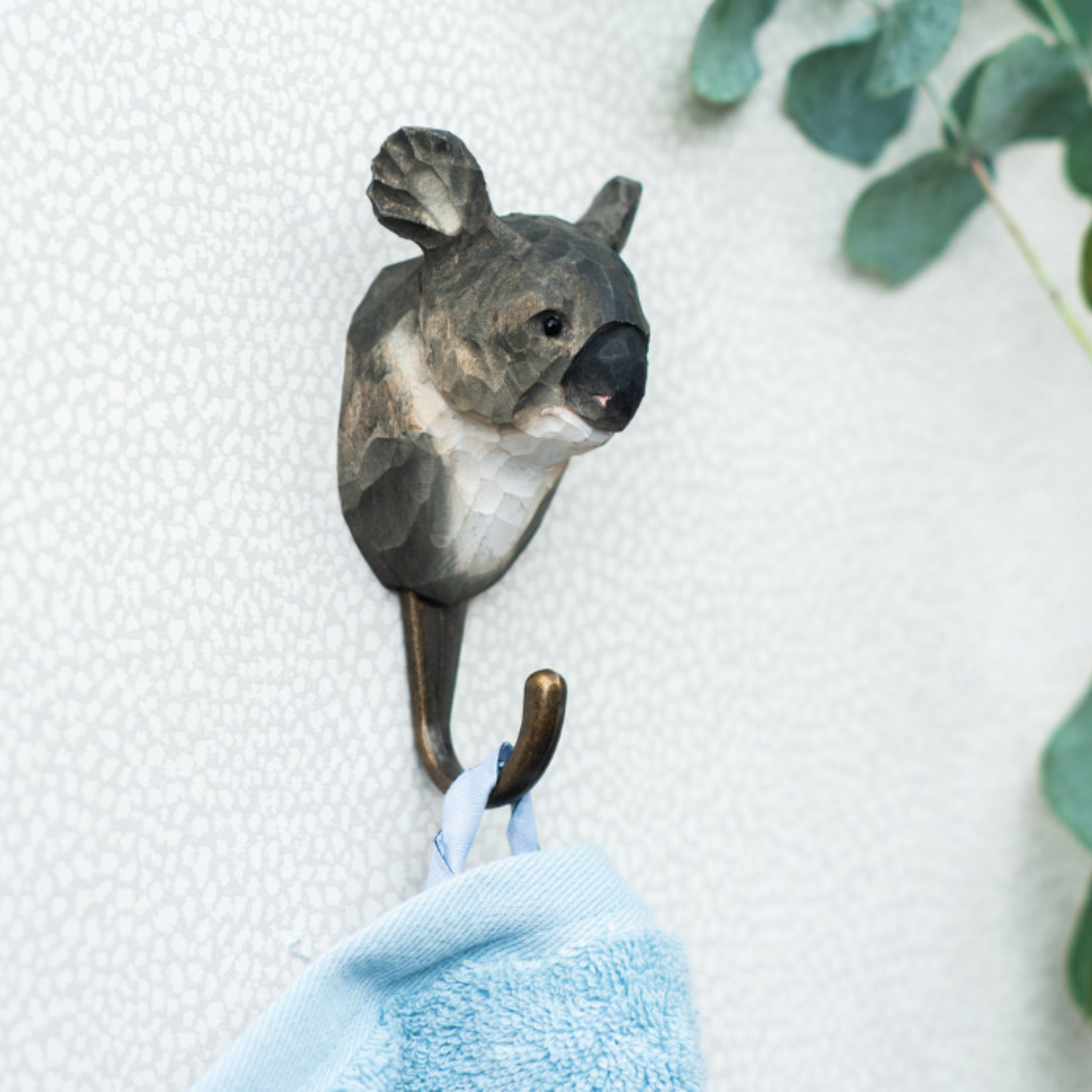 Close up of Wildlife Garden Wall Hook Koala hanging on bathroom wall with towel on hook