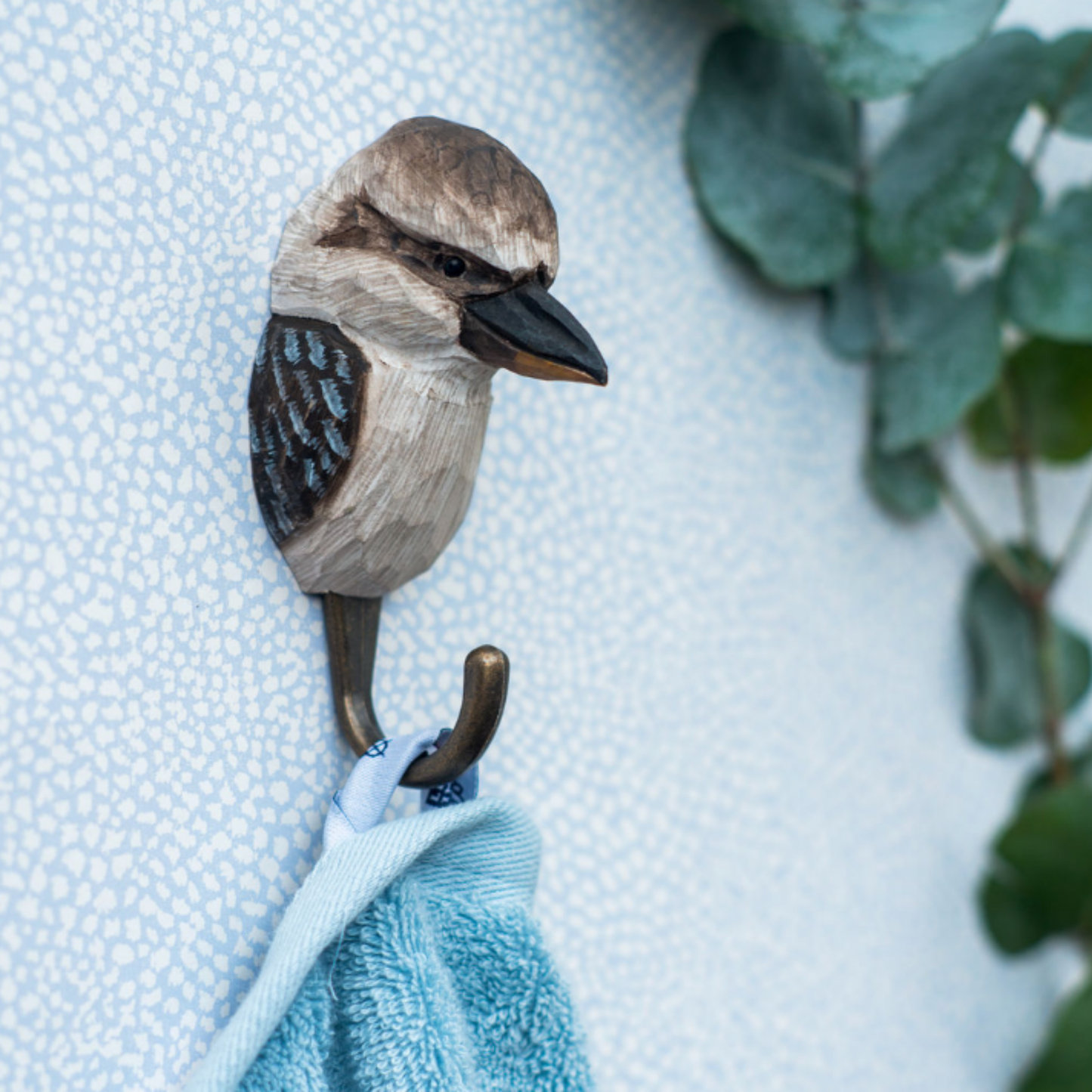Close up of Wildlife Garden Wall Hook Kookaburra on display in bathroom holding towel 