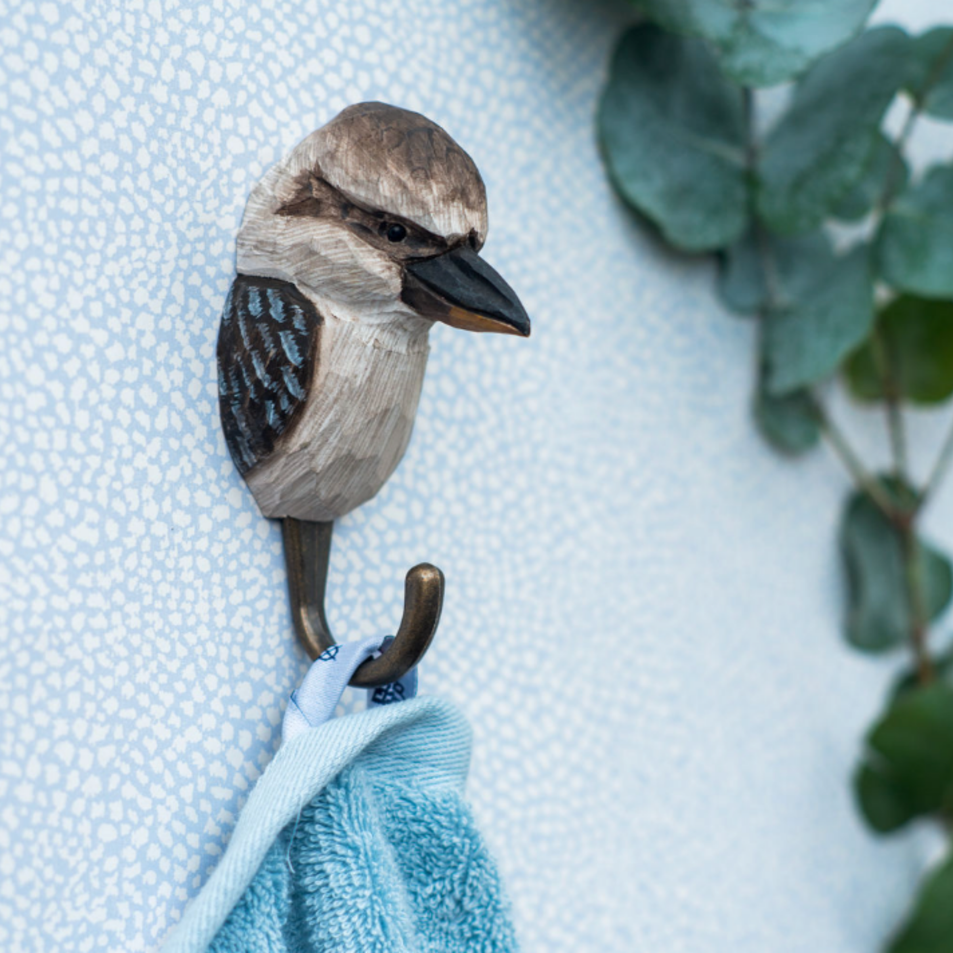 Close up of Wildlife Garden Wall Hook Kookaburra on display in bathroom holding towel 