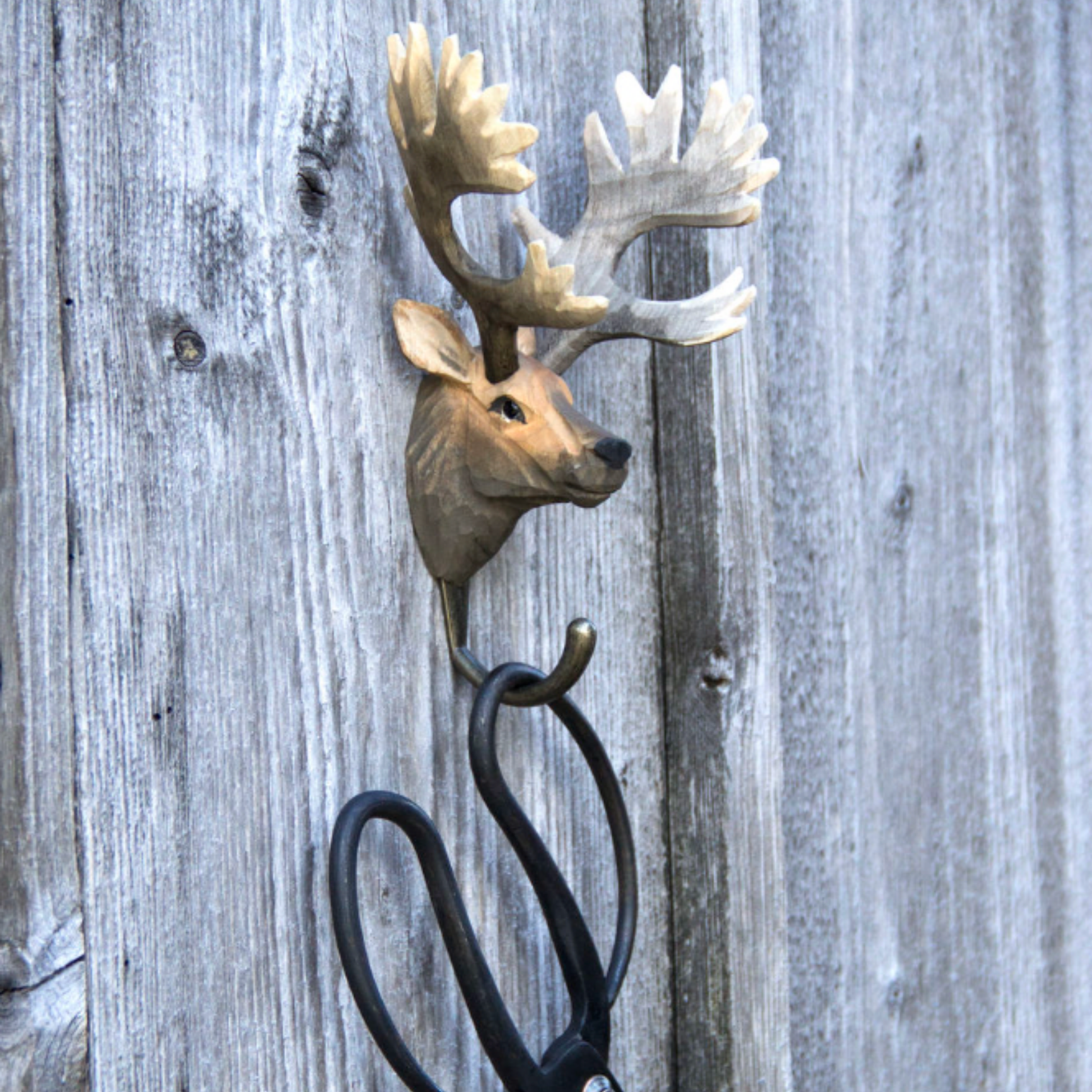 Wildlife Garden Wall Hook Red Deer hangong outside with scissors hanging on hook