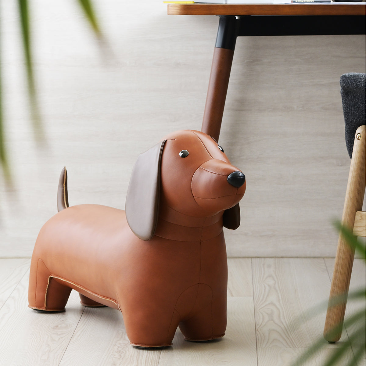 Stool Classic Dachshund Tan by Zuny shown sitting on floor next to a desk.
