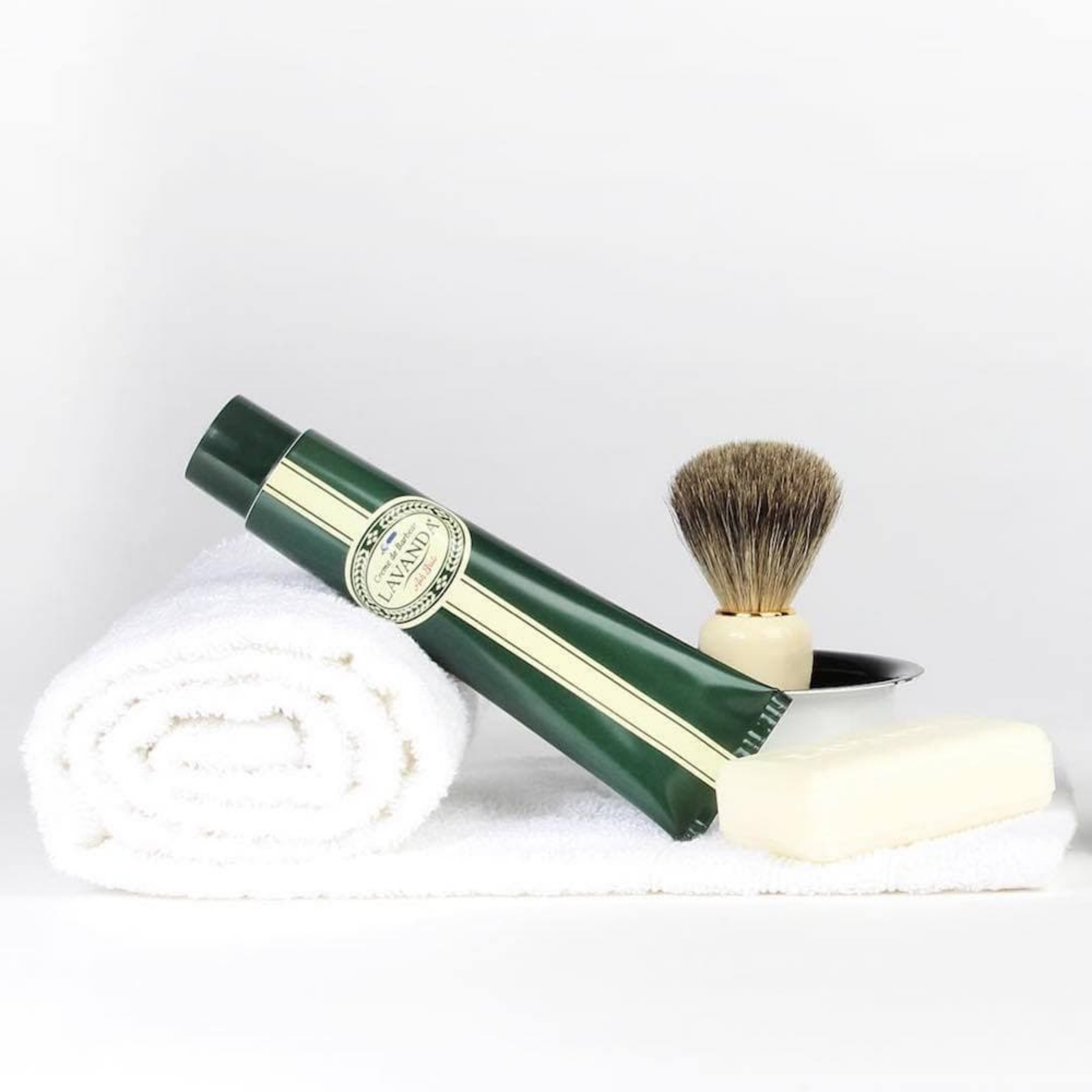 Ach Brito Lavanda shaving cream 100ml tube on display with shvaung accessories and rolled up towel 