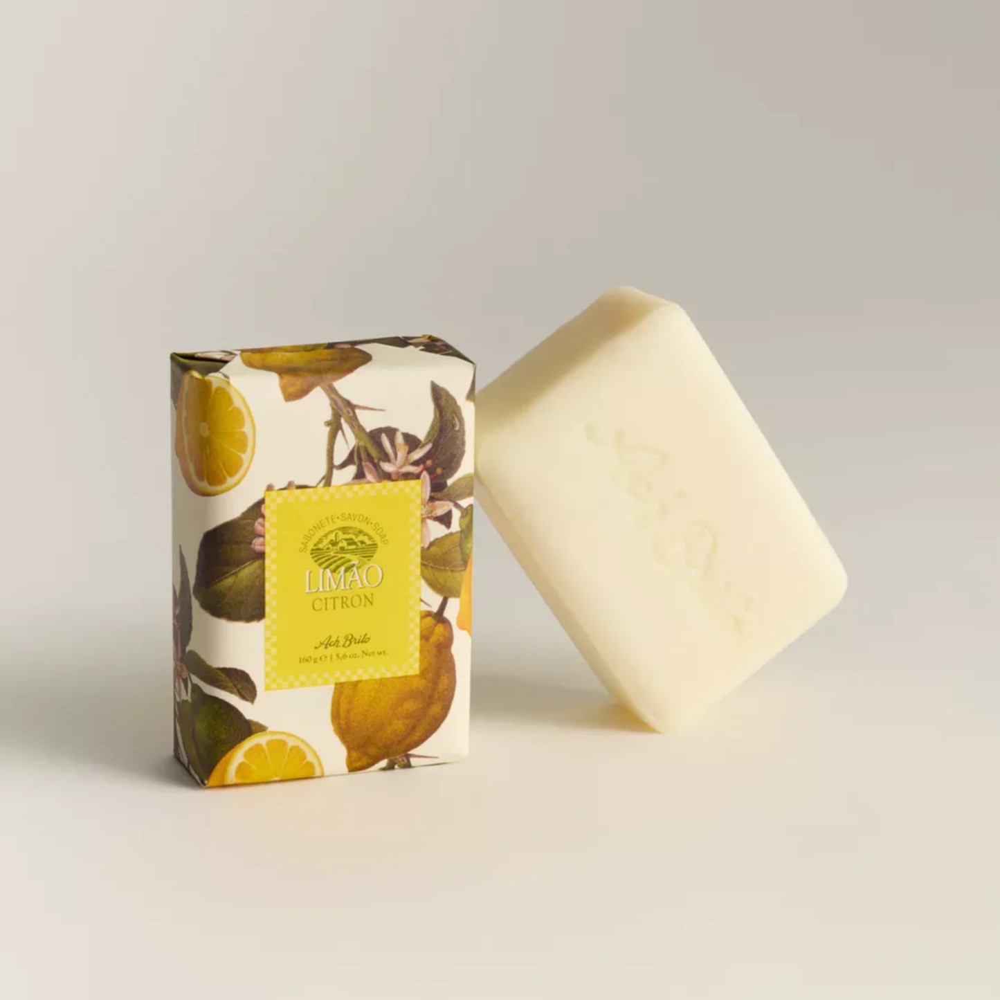 Soap and packaging from Ach. Brito Vegetable Soap 160g, light yellow lemon-scented bar made with a vegetable base, creates creamy lather, eco-friendly, ideal for daily bath or kitchen hand hygiene.