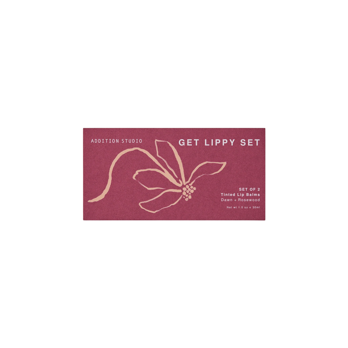 The red box of the Addition Studio Get Lippy Set for Dawn and Rosewood tinted lip balms made with camellia seed oil for hydration, nourishment, and improved skin elasticity, with arnica flower extract.