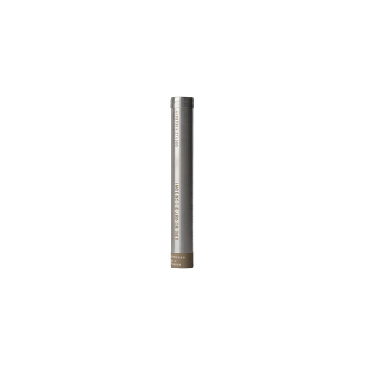 Front view of the aluminum tube of the Addition Studio Incense Set Cedarwood, Sage & Geranium (with Holder): a 15 incense stick with holder. A blend of cedar, geranium, lavandin, clary sage, Roman chamomile, and spearmint essential oils.
