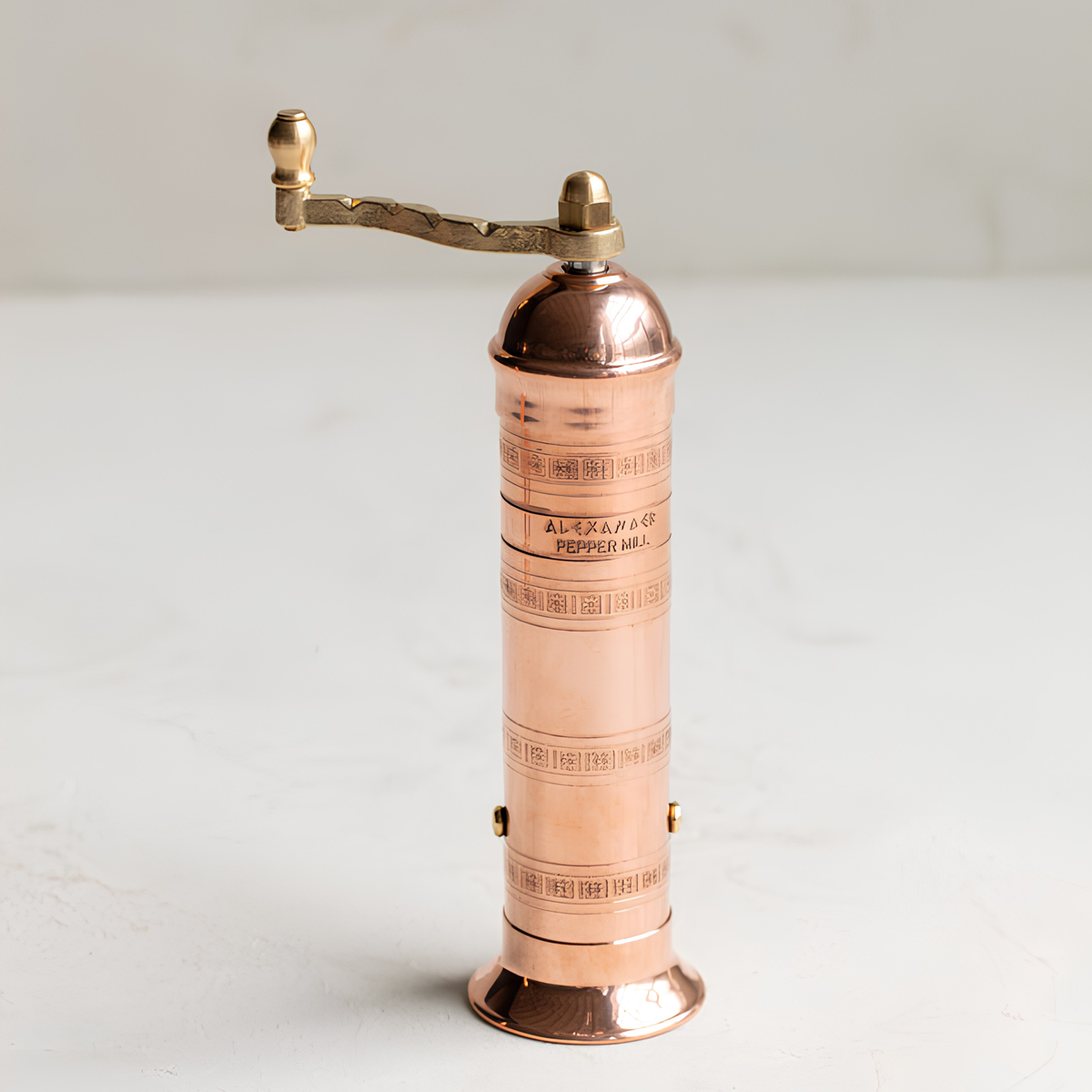 Partial top view of the Alexander Mills Copper Pepper Grinder 20cm which has 100% metal mechanism with 3DCut system to grind peppercorns fine or coarse.