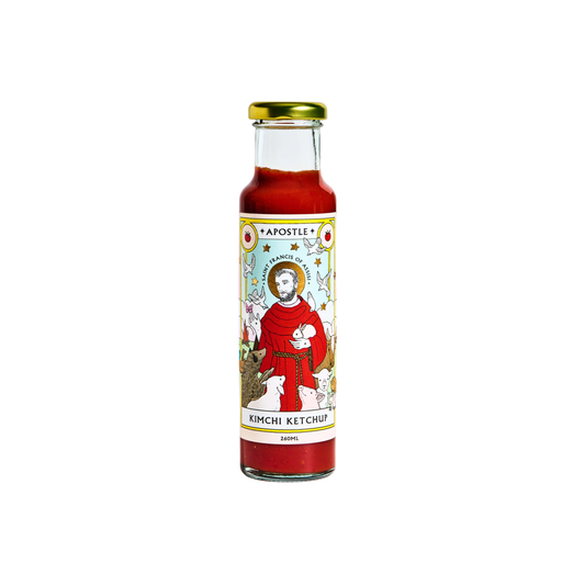 Front view of the bottle Apostle Saint Francis of Assisi Kimchi Ketchup 260ml that is 32 percent kimchi with tomato ketchup.