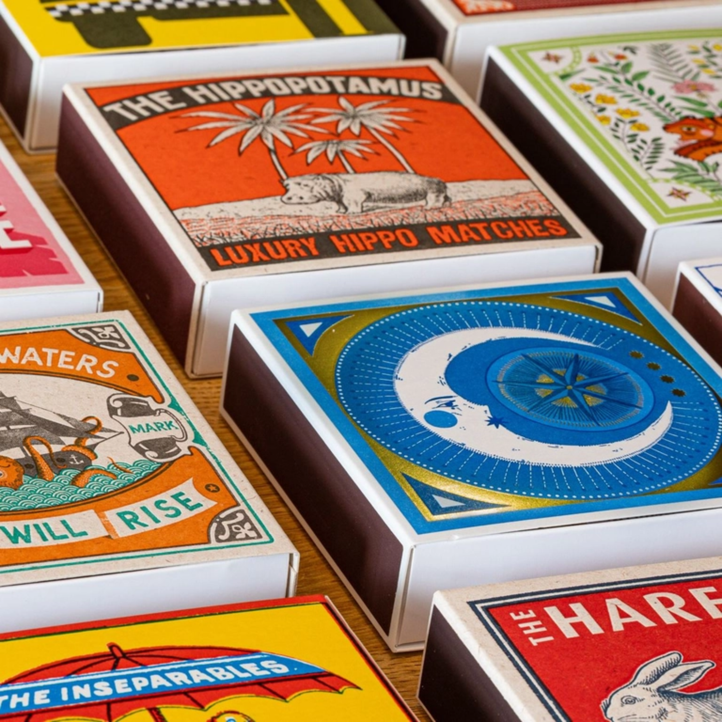 Shown with different match box styles with Archivist Hippopotamus Matches - Square Matchbox with Luxury Hippo and Palm Tree Design - 125 Natural Red-Tipped Matches - FSC Wood, UK Letterpress Printed, Eco-Friendly Decorative Match Set