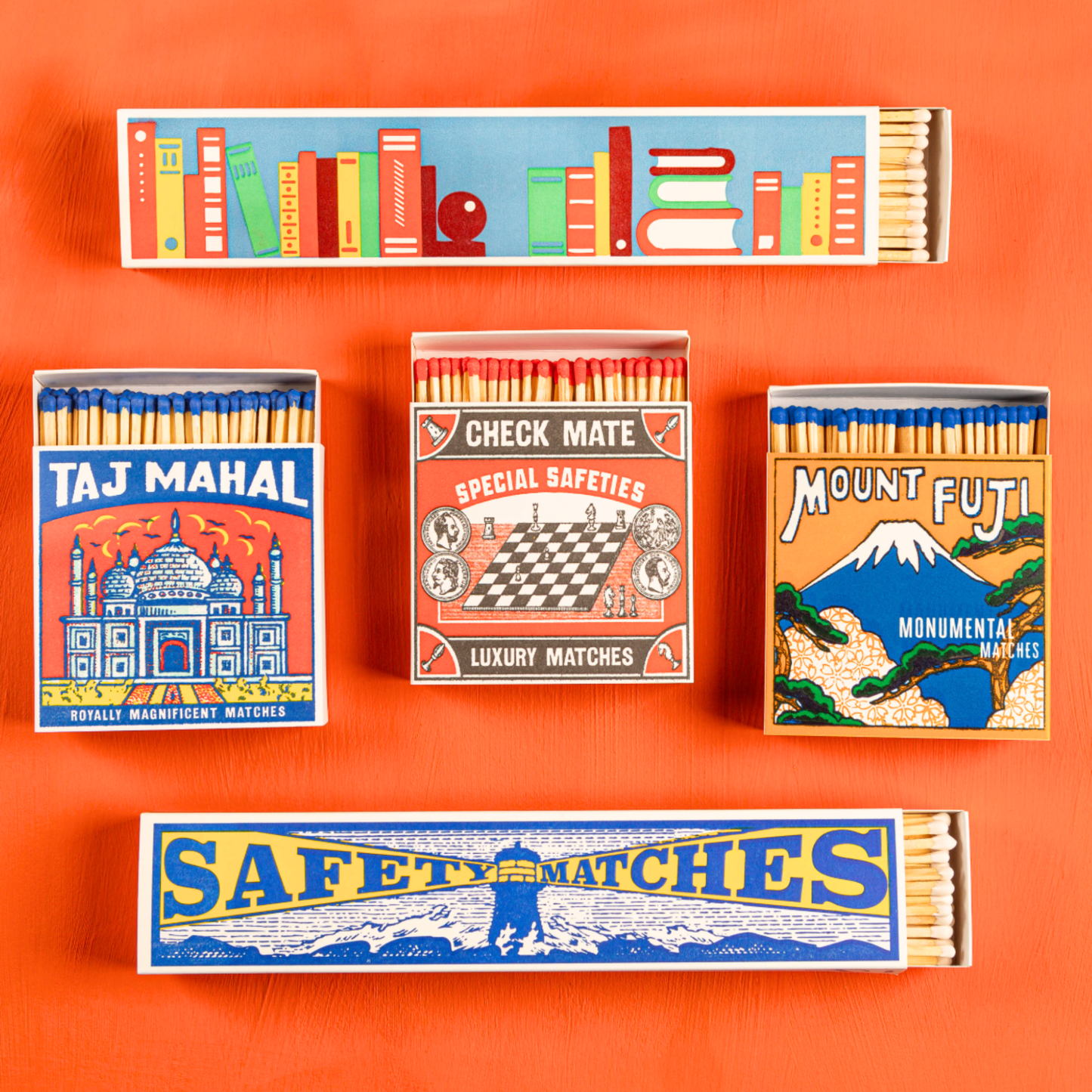 Assorted luxury matches on display in orange background