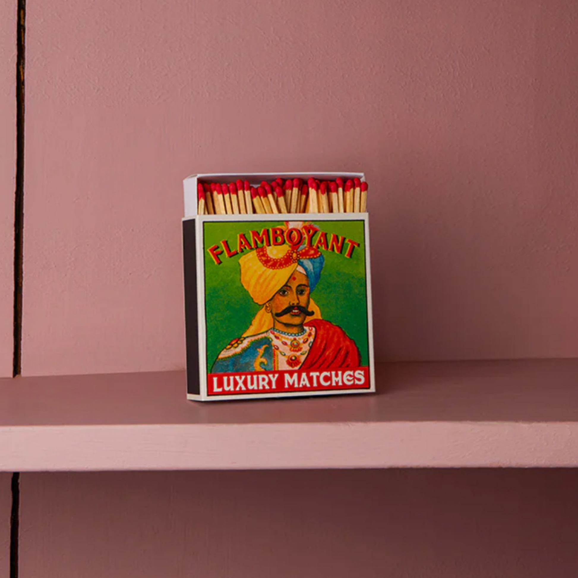 Luxury matxches flamboyant on display on dusty pink shelf