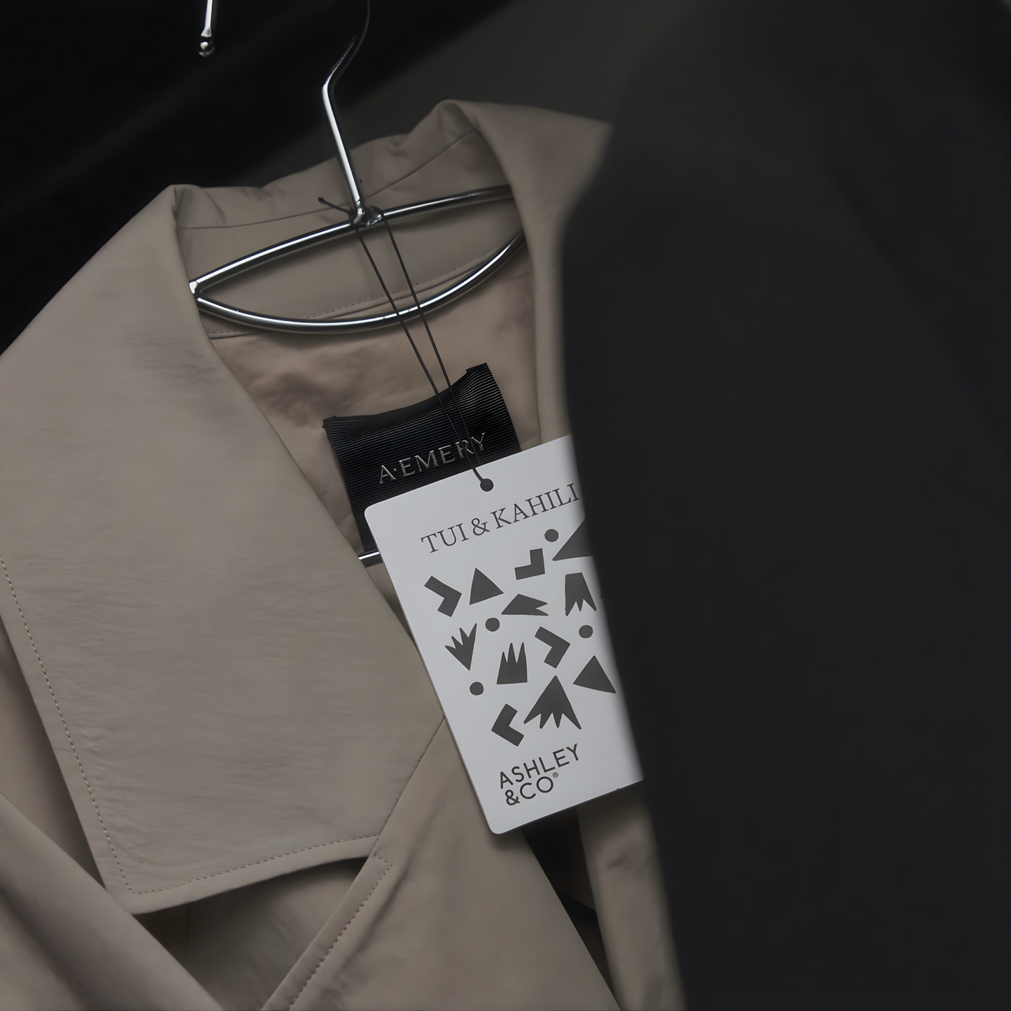 Front view of the Ashley & Co Carded Perfume Air Freshener Tui & Kahili hung on the hanger with a garment.