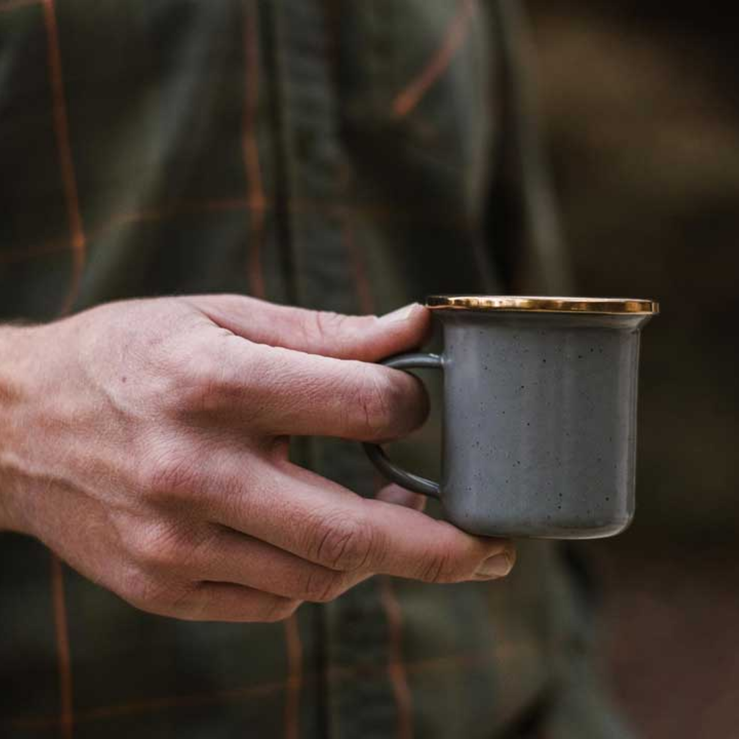 Man holding Barebones enamel slate grey espresso cup 