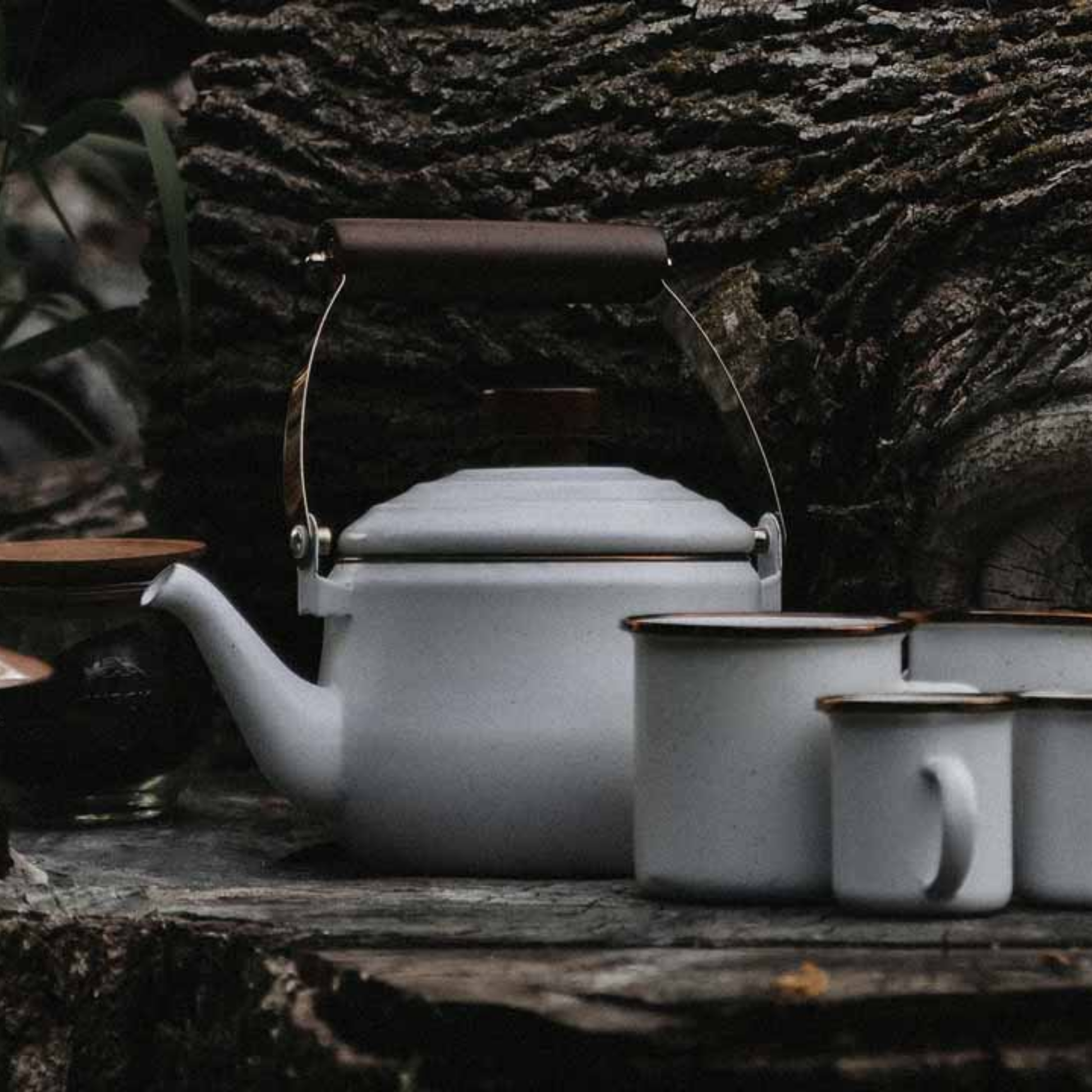 Barebones enamel teapot eggshell outside with other barebones products