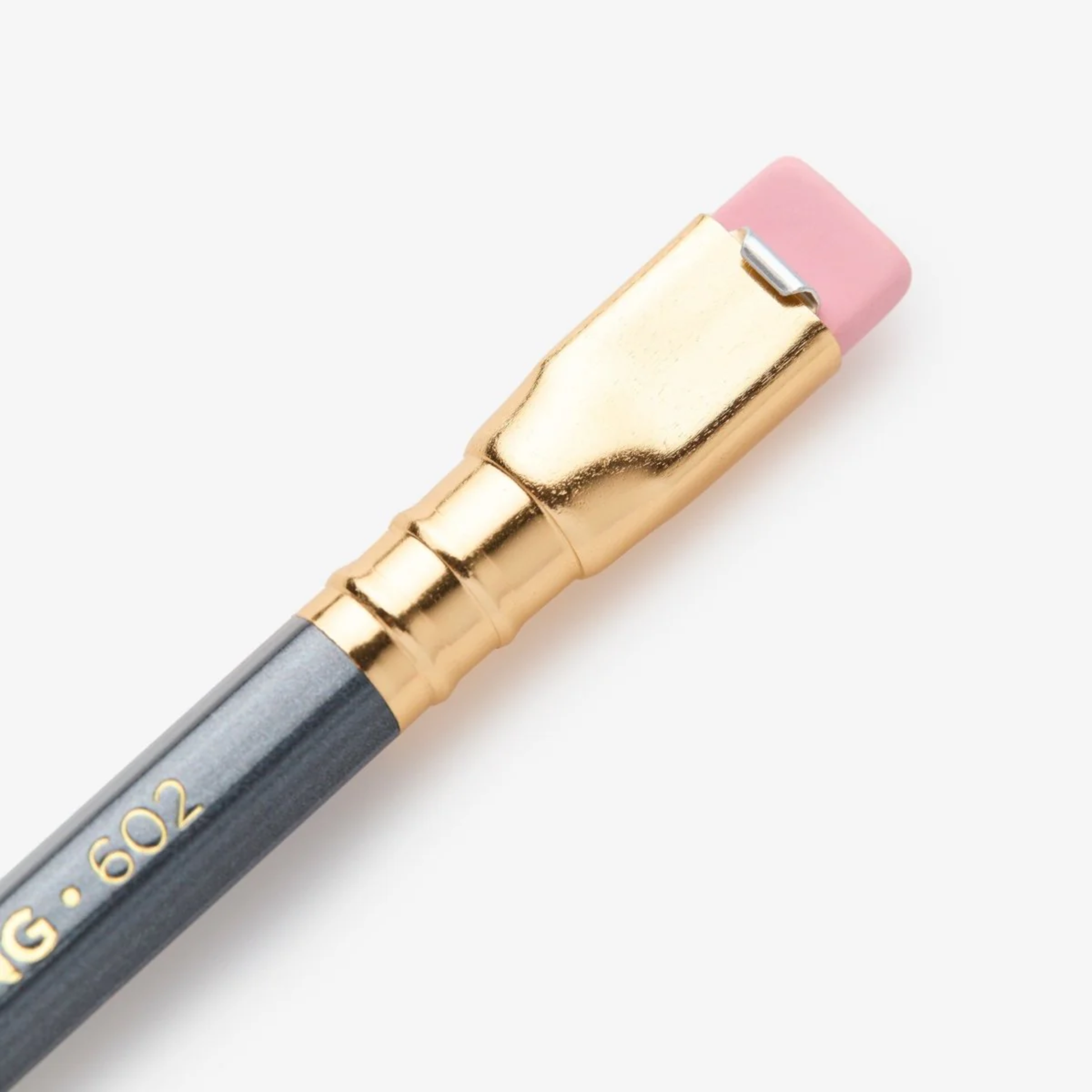 Close up view of the eraser part of the Blackwing 602 gunmetal grey pencil with firm graphite core and pink eraser - iconic 'Half the Pressure, Twice the Speed' design.