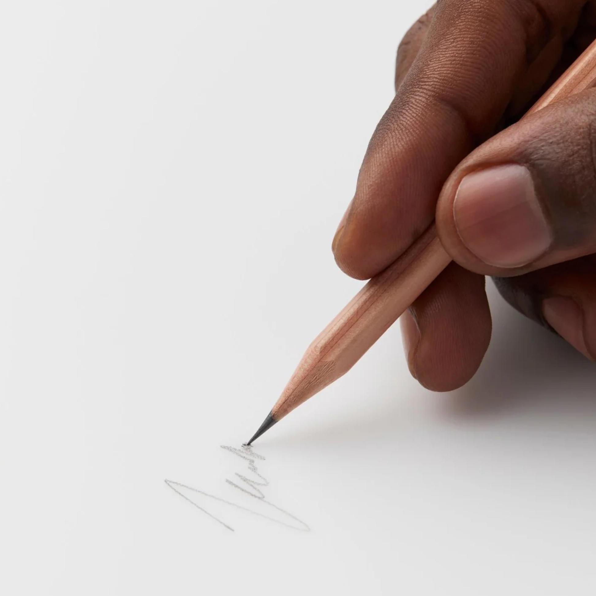 Showing the pencil in use Blackwing Natural pencil, extra-firm graphite incense-cedar pencils with clear matte finish, grey eraser, and silver ferrule for precise writing and drawing.