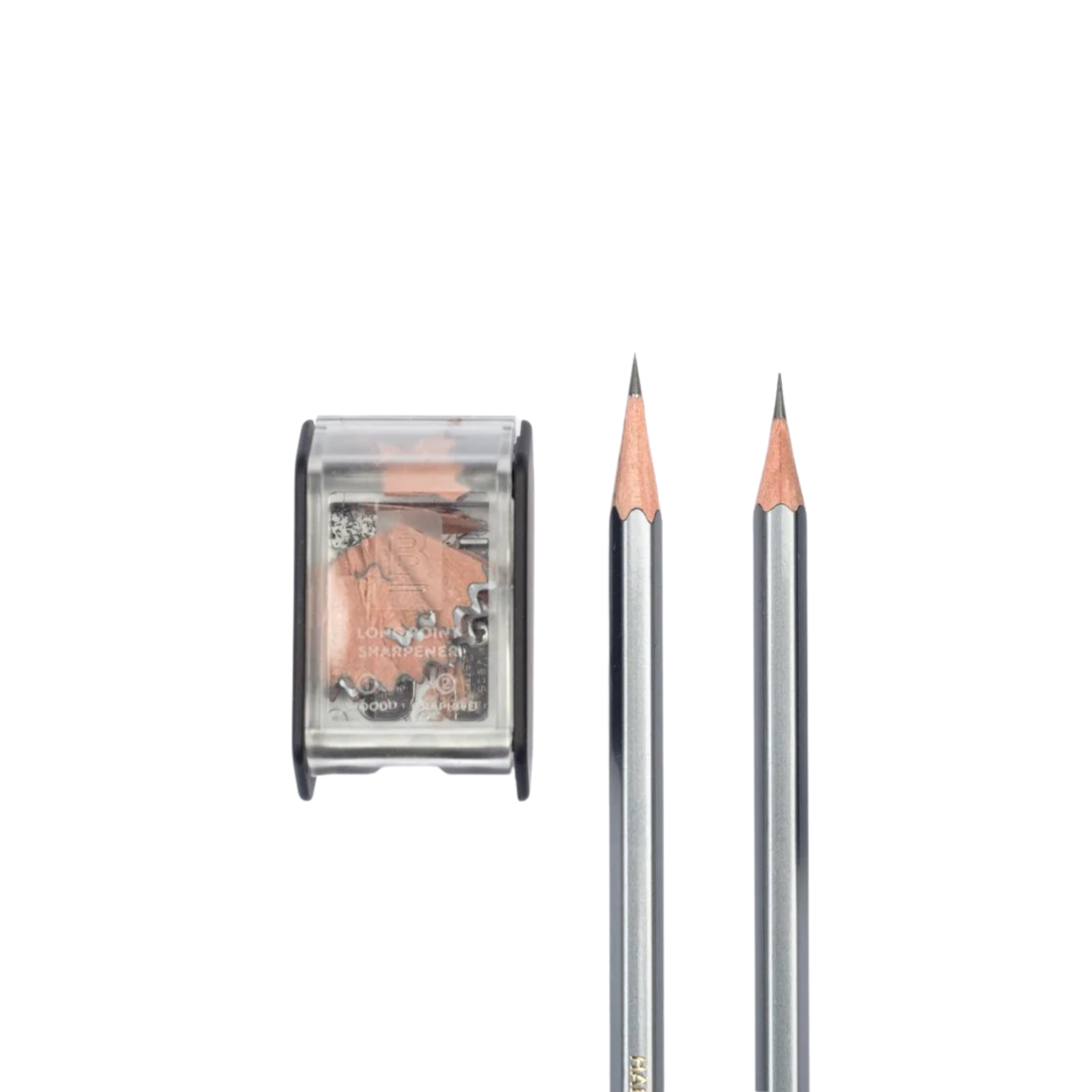 Two sharpened black pencil with sharpener in use with Blackwing Two-Step Long Point Sharpener in black with rubberized matte finish and German steel blades.