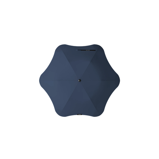 Top view of the Blunt Umbrella Metro Midnight Navy, which is compact, collapsible and convenient, consisting of the detachable UV fabric canopy, sturdy frame, shaft and handle. Fits in your handbag, tote or backpack. Built for fast living, those who travel light, and any weather.