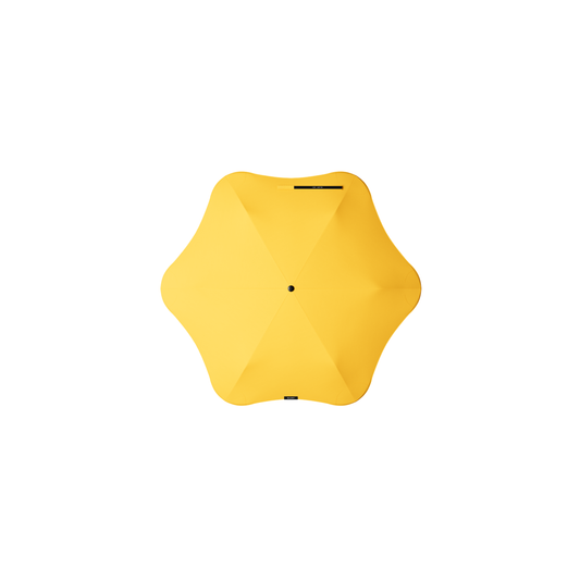 Top view of the Blunt Umbrella Neo Citrus Yellow at 98cm, featuring a compact design with high tensioned canopy, wind tested construction and recycled rPET fabric for rain or shine.