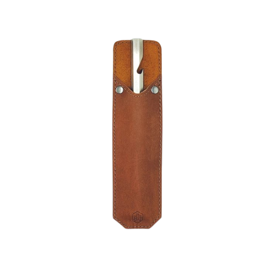 Brut Homeware burnt stainless steel bottle opener with custom buffalo leather sleeve, handcrafted in India, heavyweight 230g design for durable and stylish use, ideal as a luxury or barware gift.