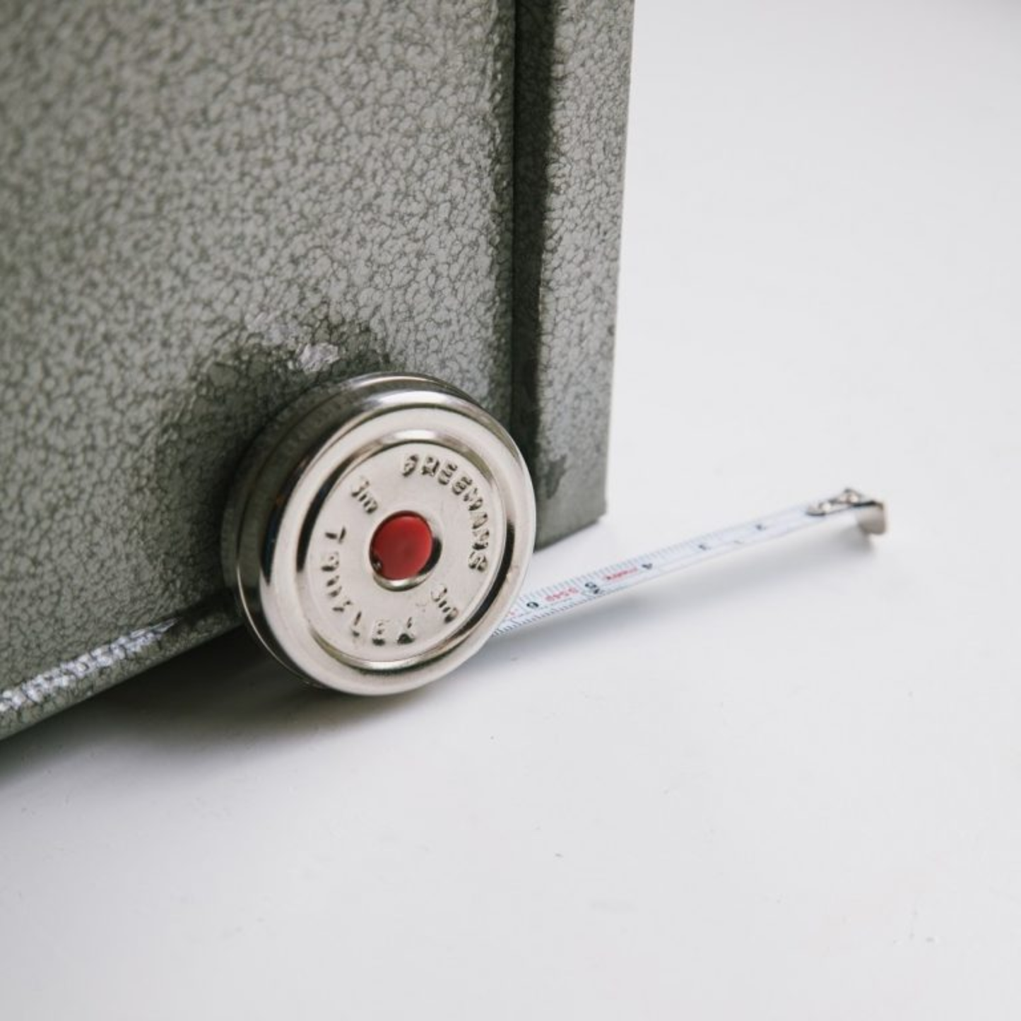 Brut Homeware pocket-size stainless steel tape measure with a 300 cm / 120 in reach, housed in a sleek silver case and packaged in a black box-compact, durable, and perfect for designers, DIYers, or as a budget-friendly gift.