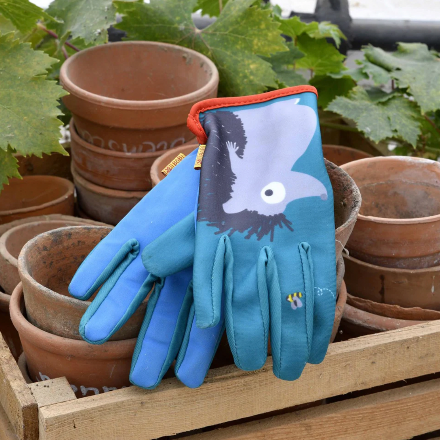Burgon & Ball kids gardening gloves hedgehog outside on terracotta pots in garden