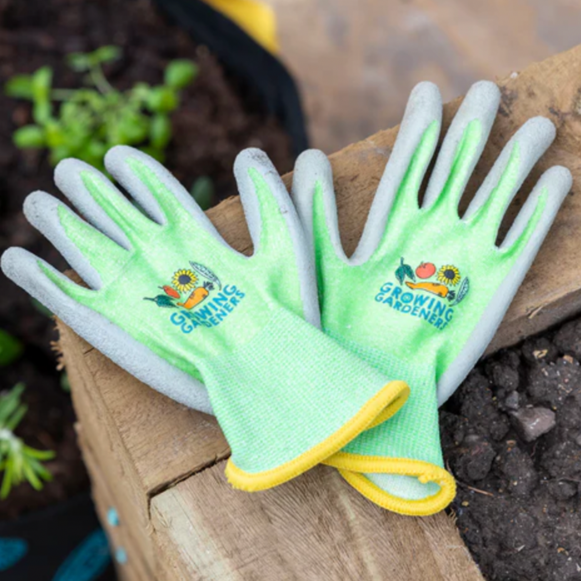 Burgon & Ball kids gardening gloves outside in garden