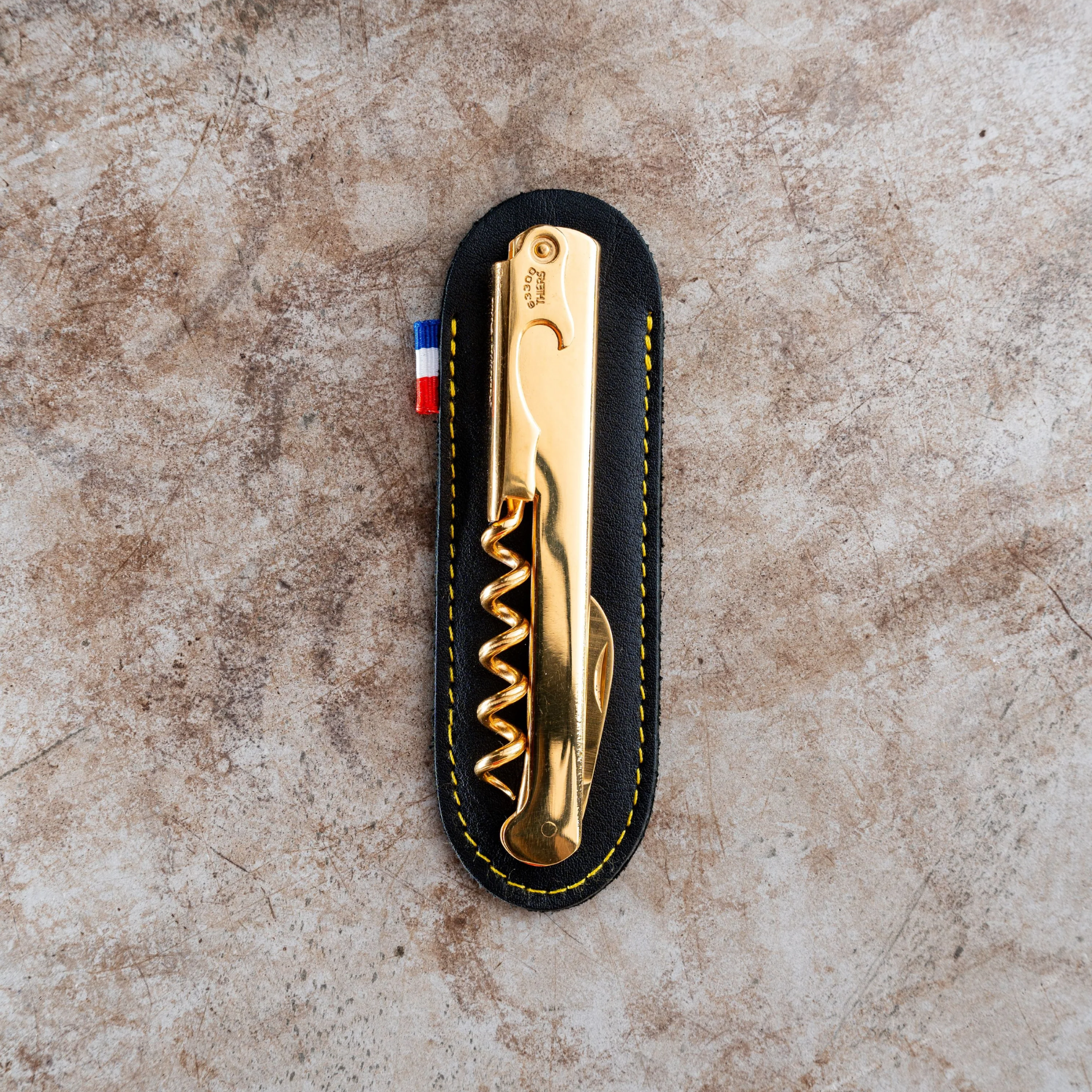 Cartailler Deluc The Original 92 Waiters Corkscrew Leather Pouch from high quality black leather with yellow stitches with corkscrew on top.