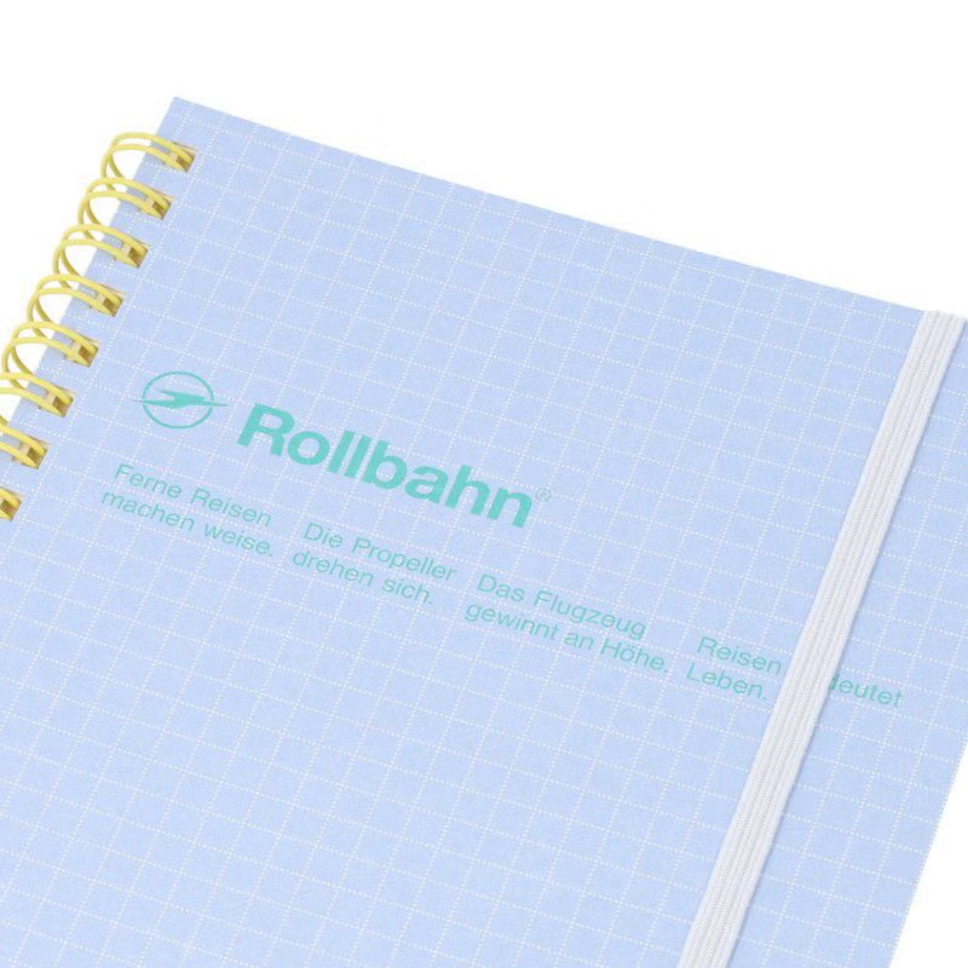 Close up view of the Fathom spiral bound retro notebook in light blue with polypropylene cover, metal spiral binding, elastic closure, and 140 perforated cream pages, large Japanese-made stationery.