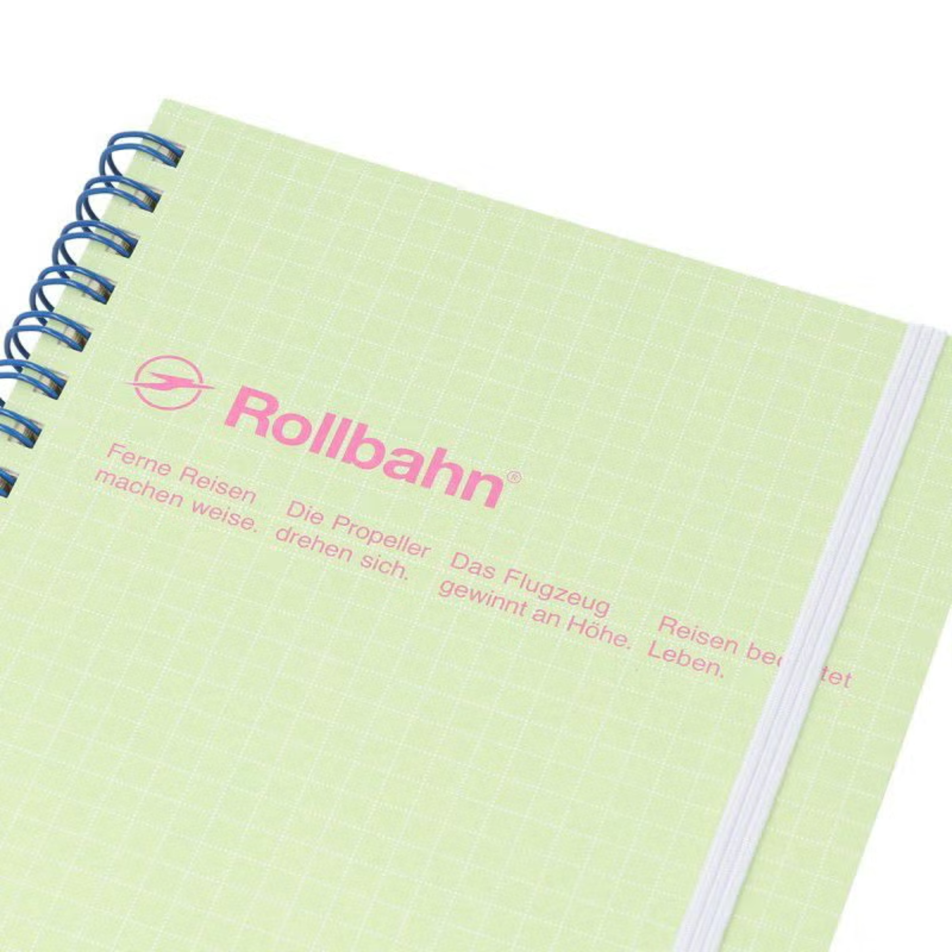 Close up view of the Fathom spiral bound retro notebook in light green with polypropylene cover, metal spiral binding, elastic closure, and 140 perforated cream pages, large Japanese-made stationery.