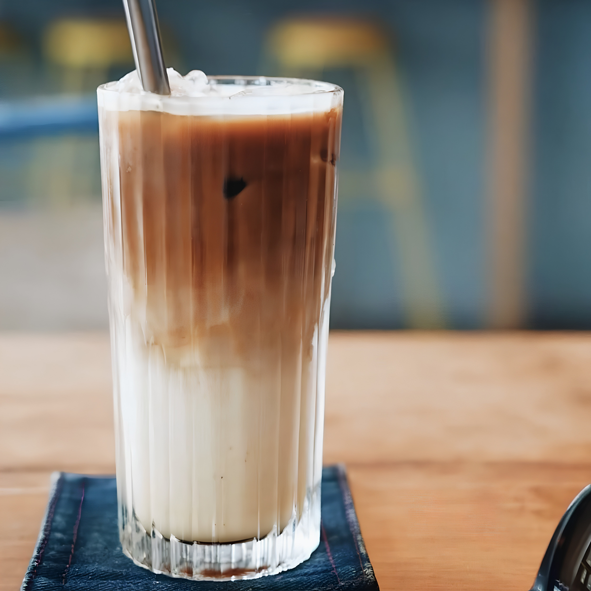 Image showing chocolate and milk drink in the Duralex Manhattan Highball Tumbler 305ml Set of 6 in clear, made from impact-resistant tempered glass with an elegant, tall design ideal for serving cocktails and mixed drinks.