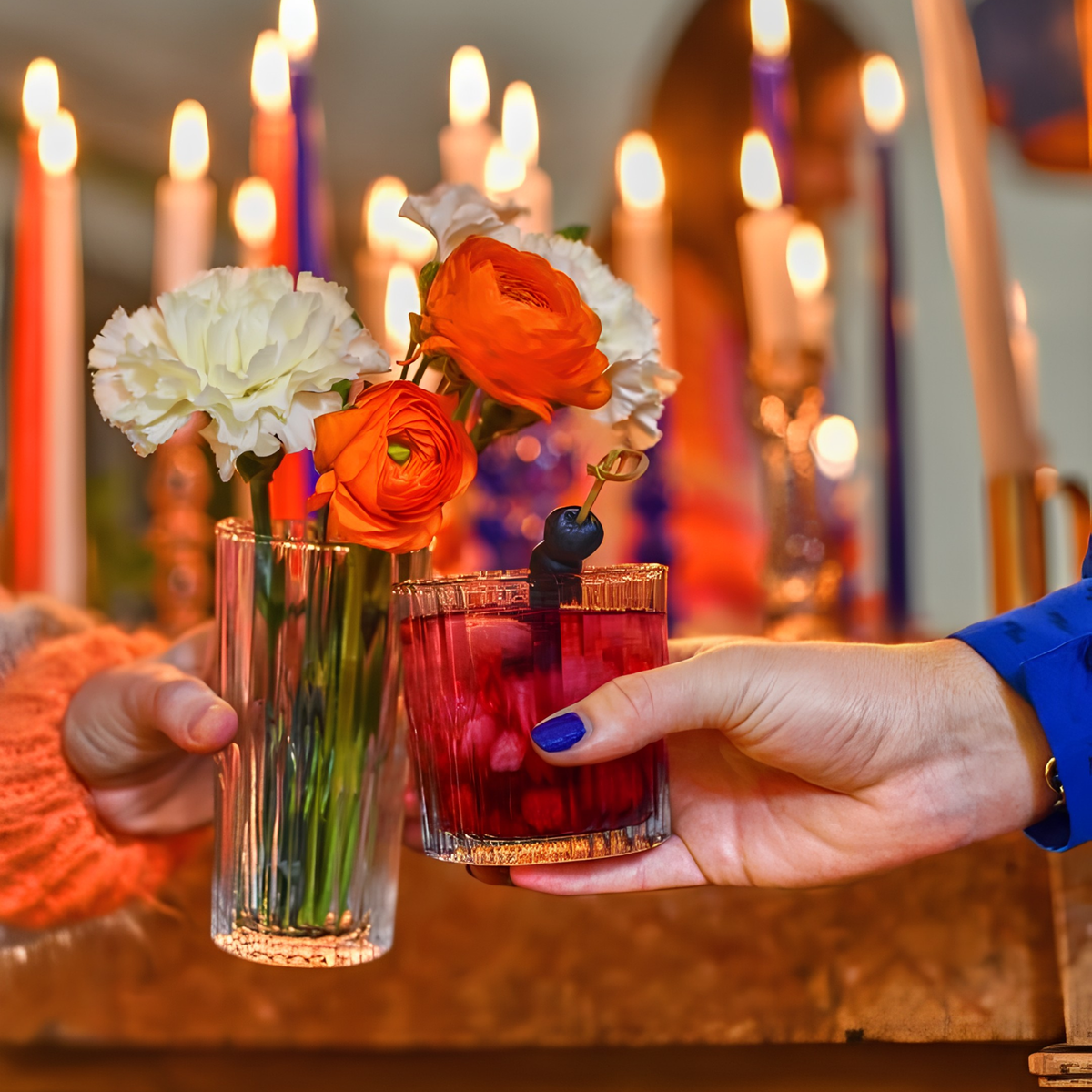Image showing flowers inside the Duralex Manhattan Highball Tumbler 305ml Set of 6 in clear, made from impact-resistant tempered glass with an elegant, tall design ideal for serving cocktails and mixed drinks.