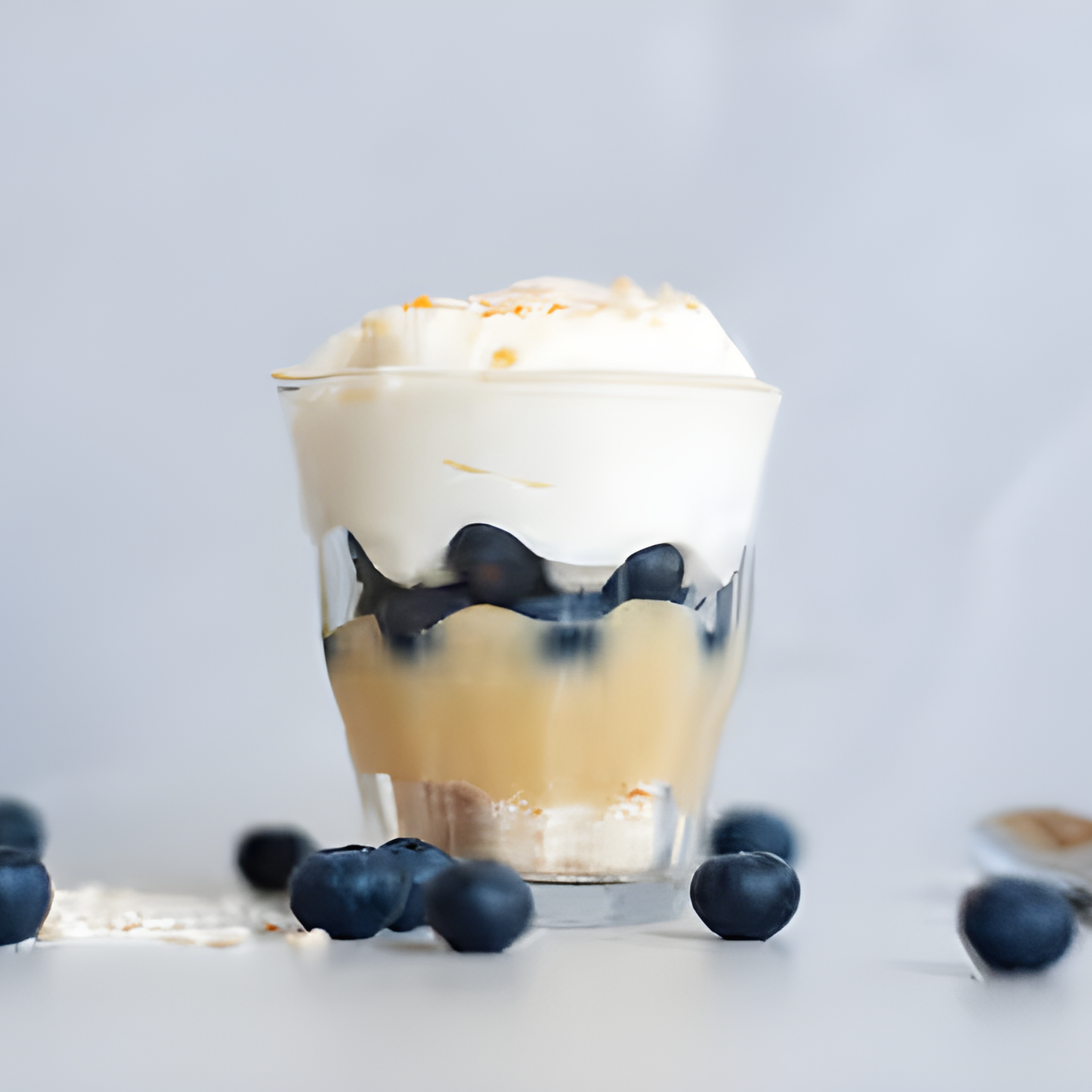 Clear Duralex Picardie tempered glass tumbler filled with ice cream, showing its thick base and durable French tempered glass design.