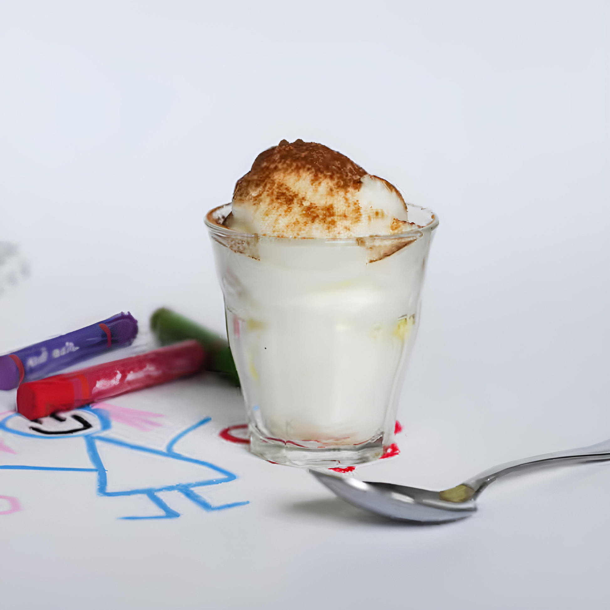 Duralex Picardie tempered glass tumbler in use, filled with ice cream, featuring durable thick base and clear tempered glass 3.5 times stronger than ordinary glass.