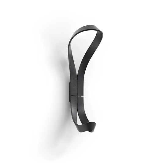 Essem Endless Hook Black textured designed by Anna von Schewen from recycled aluminum hung on the wall.