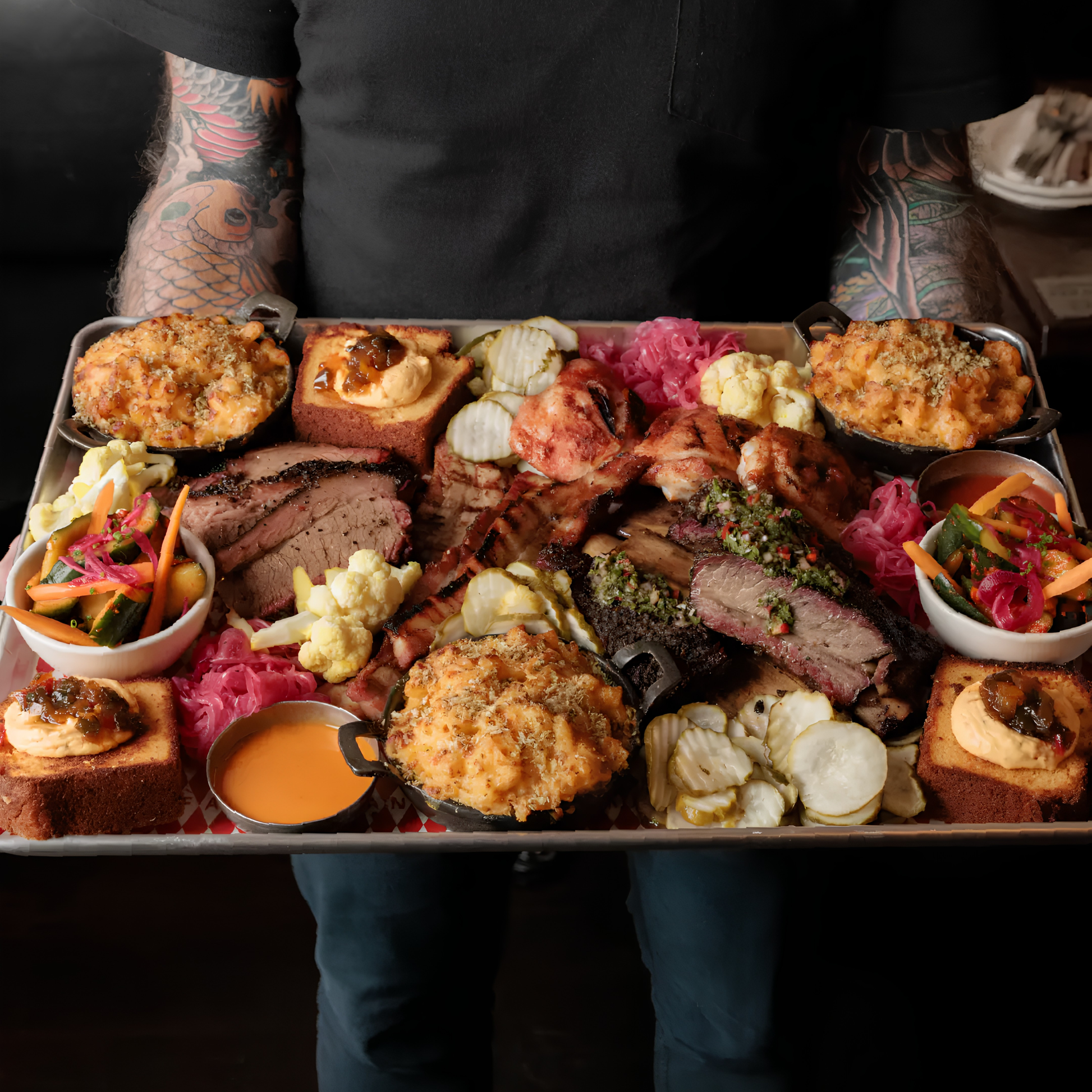 Showing the food with the barbecue to use the Fancy Hanks Original BBQ Sauce 330ml with, which is a slow-cooked American style barbecue sauce that is tangy, rich and molasses layered depth.