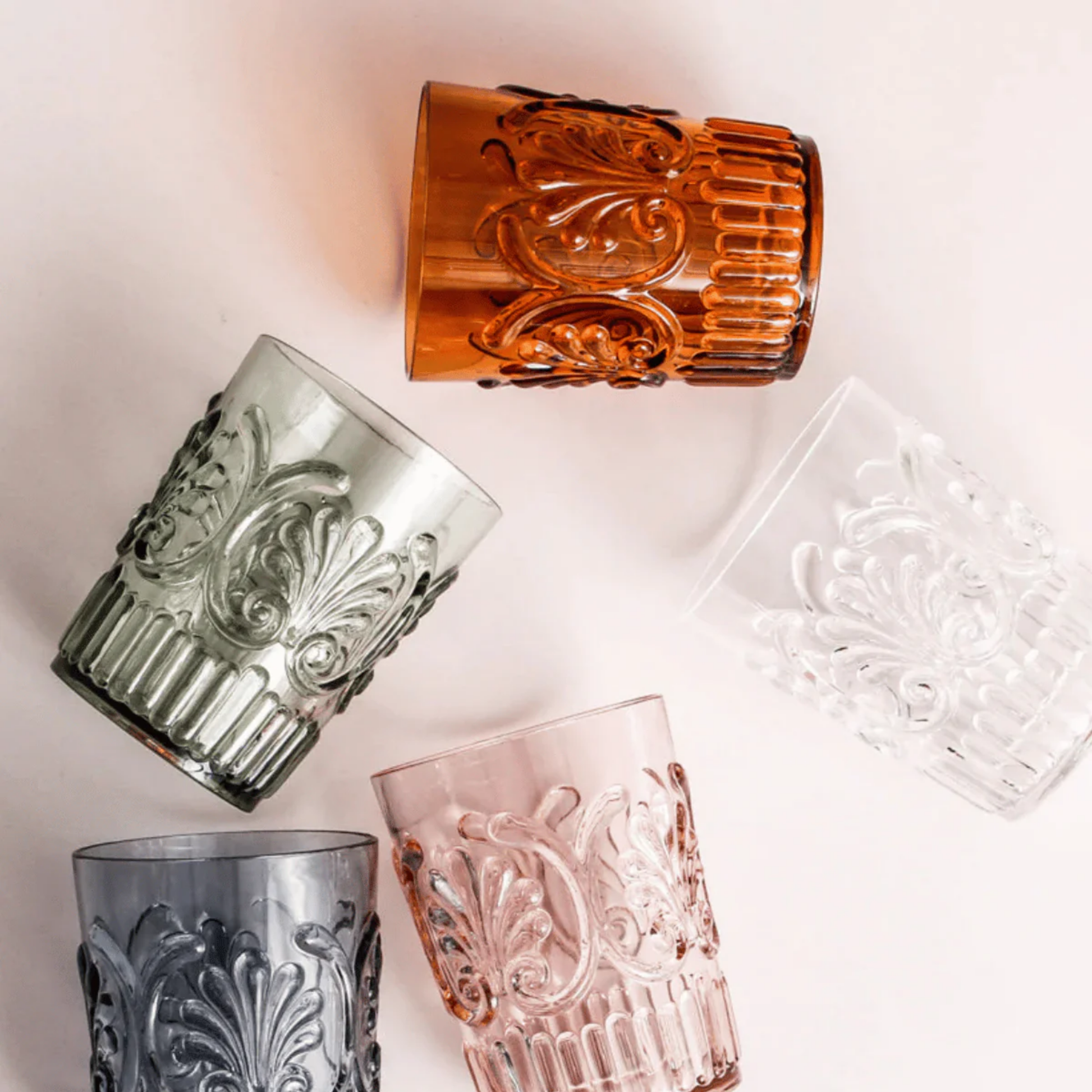 Collection of acrylic tumblers on table overhead view