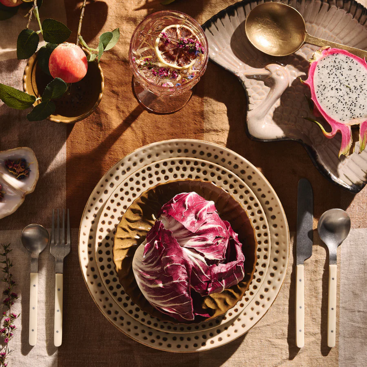 On a table setting Fathom Acrylic Wine Glass Pale Pink featuring a refined shape and durable BPA-free plastic ideal for outdoor dining or special occasions.