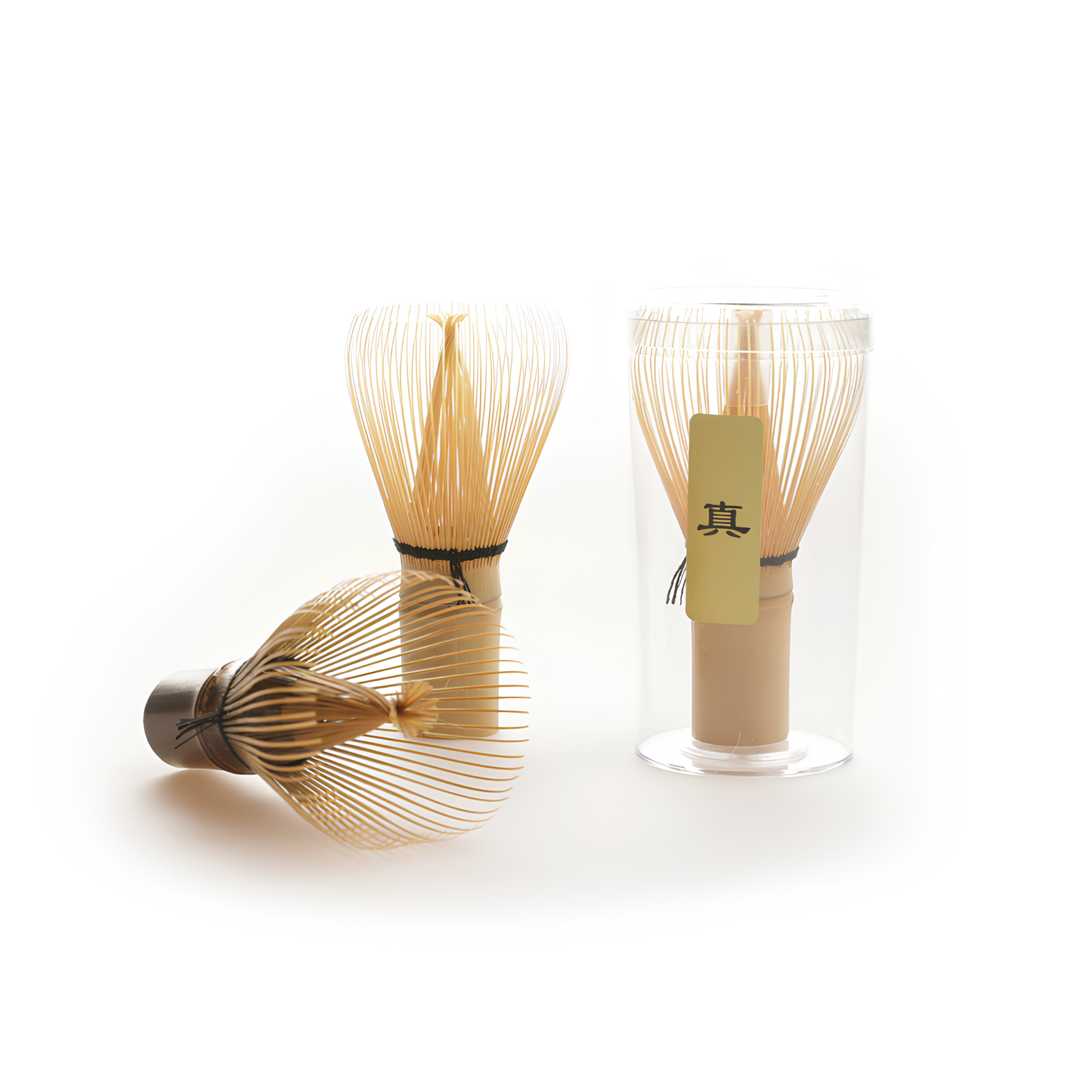 Standing with a dark version, the Fathom Bamboo Matcha Whisk Light also known as Chasen, from a single piece of Bamboo in Japan, for preparing matcha.