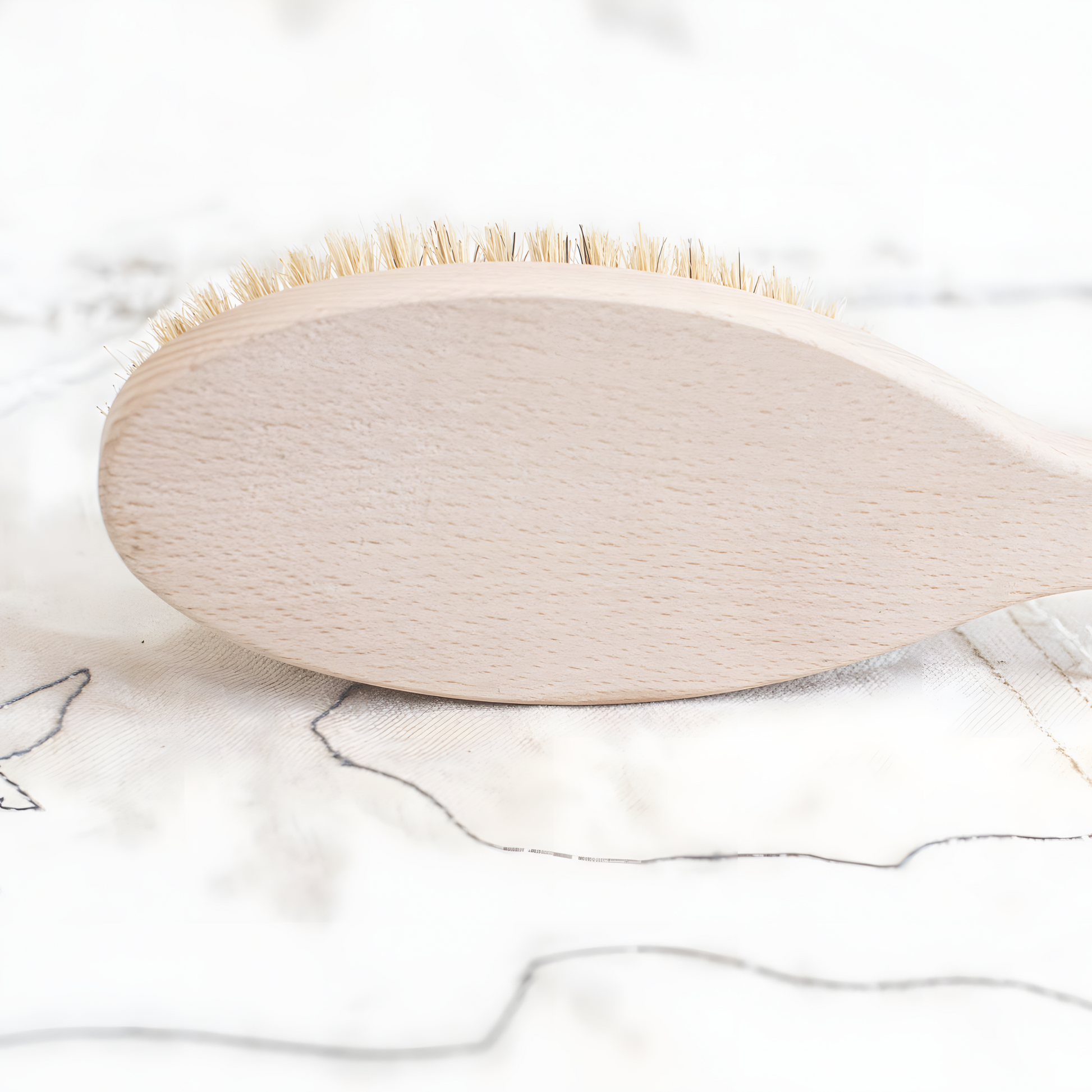 Brush facing left and showing the wooden back for Fathom 38cm beechwood bath brush with natural bristles, single-piece German-made bath brush for gentle skin exfoliation and cleansing in the shower.
