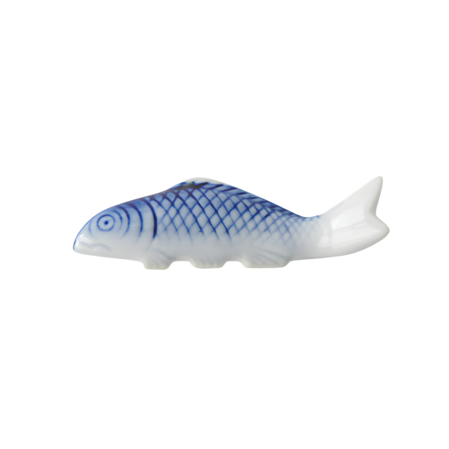 Side view of the Fathom Chopstick Rest Blue Fish that has slight irregularities in size, glaze and texture from the artisan of the product