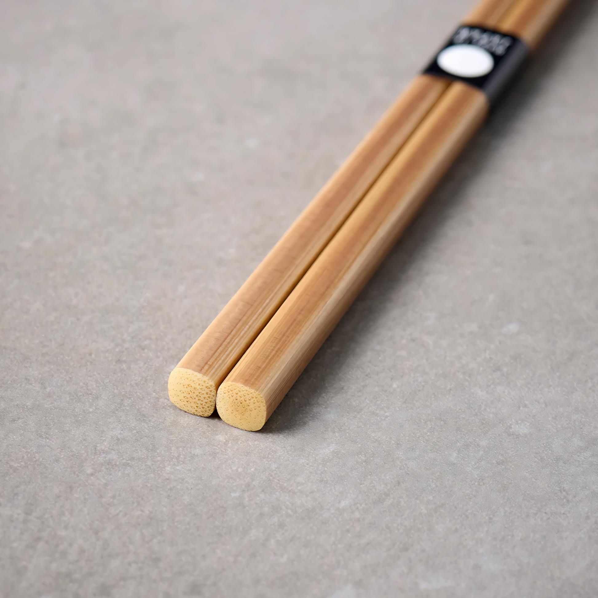 Close up on the bottom part of the Fathom Chopsticks Pair Bamboo Brown featuring a clean, understated finish with subtle grain variation.
